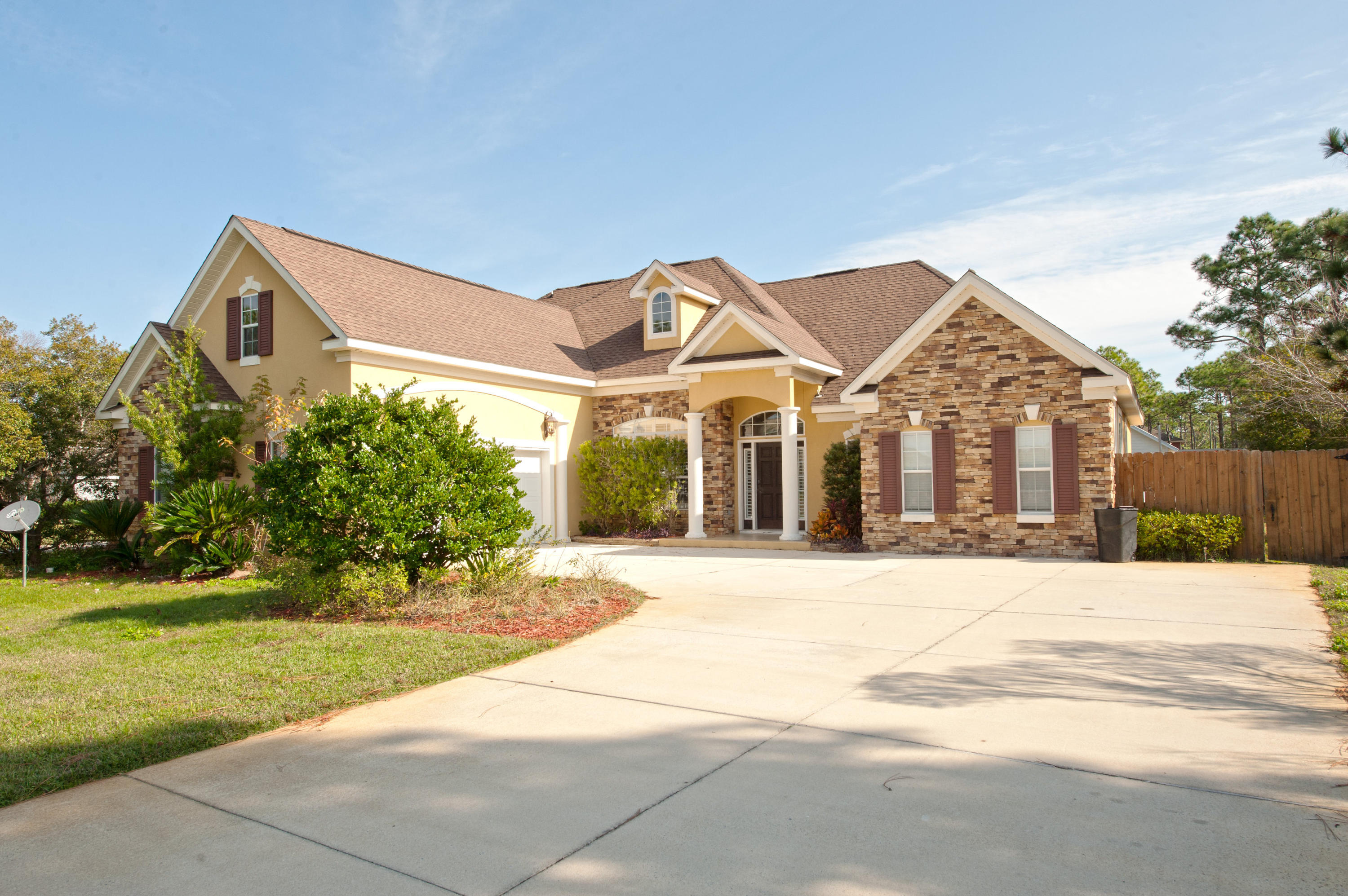 Customized, charming, beautiful home, situated in a gated community. Enjoy the gourmet chef kitchen which includes: stainless steel double convection oven, double refrigerator and gas stove. A Built-in Buffet adorns large Dining Room. Relax and enjoy a good movie or game in the Bonus Media Room which has a 100 Inch Screen. There are tasteful Plantation shutters and blinds; upgraded Bronze Fixtures and a Master Walk-In Closet with built-in shelf system. The ceilings are 12 feet in the living room, dining room, kitchen and foyer and tile throughout the downstairs living area and baths. Your new home is pre-wired for surround sound. Take a dip in the heated, in ground pool situated on this very large fenced in property.Bayside community dock, tennis and basketball.Make This your home toda