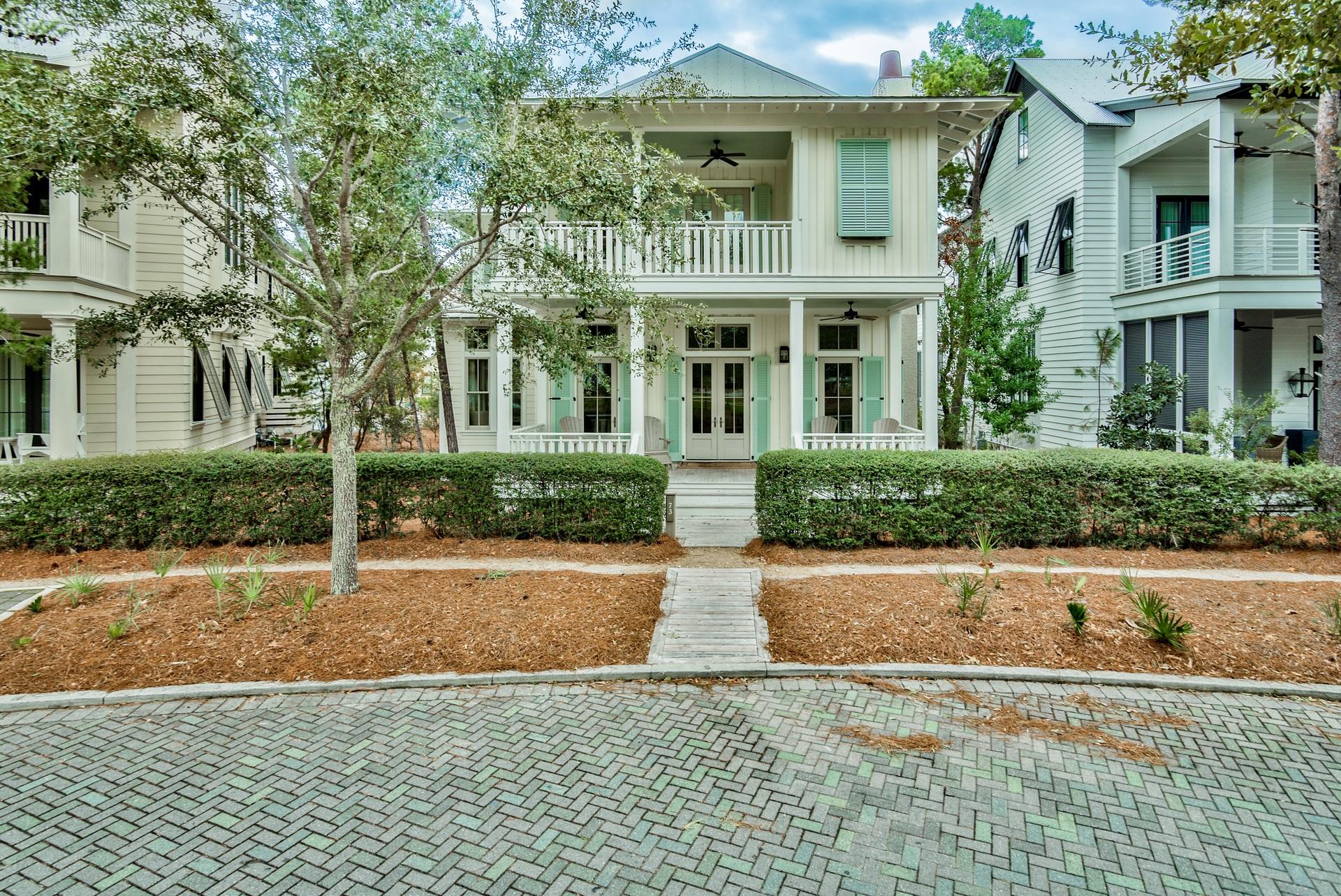 This stunning home is nestledin a prominent location on Sand Hill Circle in Watercolor's Lake District, directly on the park across from the Frog Pool. This newly renovated 5 bedroom, 4 bathroom home has an open floor plan, spacious for large groups. Entering the house, you are immediately greeted by an expansive view of the kitchen, living, and dining area. The kitchen is guaranteed to delight gourmet chefs and entertainers alike, with two granite islands equipped with stainless steel appliances and a walk-in pantry. Off of the dining area is a study with functional custom built-ins. The first level offers one master suite and en suite bathroom. The second level is home to four additional bedrooms, including an impressive kids' wing with two bedrooms furnished with 4 twin beds in one
