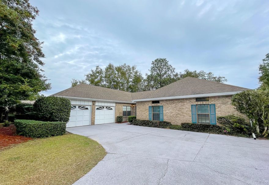 **Be sure to check out the 3D Matterport Tour!** Welcome home to this large 4 bedroom, 2 and a 1/2 bath home located on a quiet cul-de-sac with almost a half acre lot (plenty of room for a pool, boat, or RV) and zoned for Niceville's most desired schools.  Seller is in the process of having a new roof installed. Buyer can choose the shingle color if an offer is accepted in a timely manner. This home is open and bright with high ceilings and plenty of light in the living areas.  A large and functional kitchen boasts 14' vaulted ceilings, tile floors, LED fixtures, a sink with garden window, electric cook top, and a breakfast bar.  Adjacent to the kitchen are 2 separate living areas which can be used as a formal dining room, home office, play room, or even a homeschool (click more) classroom. The kitchen is open to the 22 x 22 great room which features high cathedral wood ceilings, a brick walled fireplace with raised hearth, and built in shelves.  Exit the great room via french doors to yet another living space - a 342 SF heated and cooled Florida room.   The master suite has vaulted ceilings and is spacious in size, certain to fit all of your large furniture to include a king sized bed, over sized dresser and wardrobe. The walk-in closet space is great for those who have a lot of clothing. The master bathroom is massive (20 x 11) with 2 individual sinks and vanities, an additional make up vanity, a whirlpool jetted tub, separate walk in shower and private toilet room.   Three Additional bedrooms are large with plenty of closet space. The entire yard has an irrigation system with well pump and timer, and the rear yard is privacy fenced with a large open patio.  This large executive type home is dated, but with the space it provides, the options are endless.   This is one of the best deals around and definitely wont last long!! The Raintree Estates neighborhood has a private beach park with dock and access to the Choctawhatchee Bay, and a woods park where you can enjoy nature, a soccer field and baseball diamond. All of this with only a 5 mile drive to the beautiful beaches of the Emerald Coast. Non-Mandatory HOA dues are $110 annually.