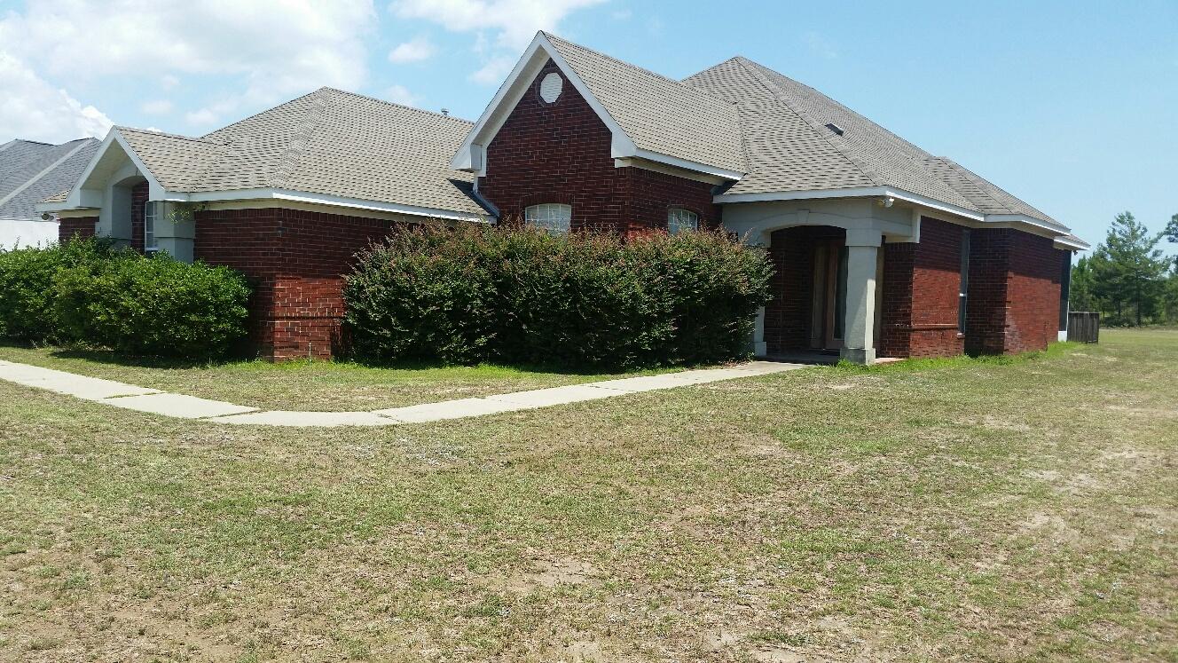 This Stunning 3/2 Beautiful Brick Home backs up to the 9th Tee of the Golf Course. It features a lot of Custom Work. It has Tray ceilings, Hard Wood Floors, Custom Plantation Shutters, and Custom Cabinets. The Bathrooms are state of the Art with Tile and Granite. This home features a Gas Fireplace and Gas Stove. It is Move in Ready. Schedule your showing Today!
