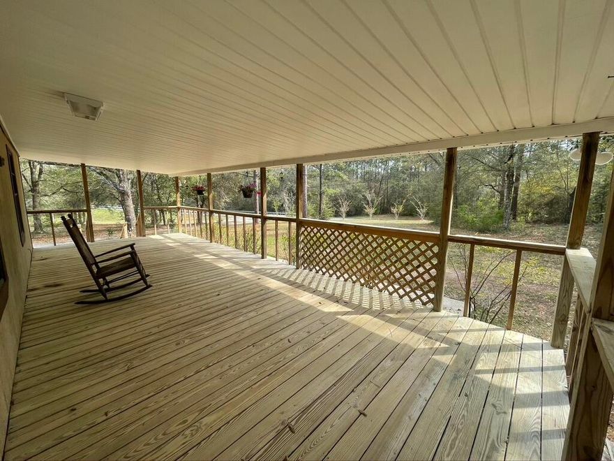 Over 3 Acres with a Huge Barn 40x65 ! New Paint New Carpet ! Ready for your family! Relax on the Front or Back Rocking Chair porch!  Step into contemporary comfort in this spacious home. Plenty of space for relaxing or kids to run around! Irrigation, well, and community water! Lots of deer , woods , and room for your animals!