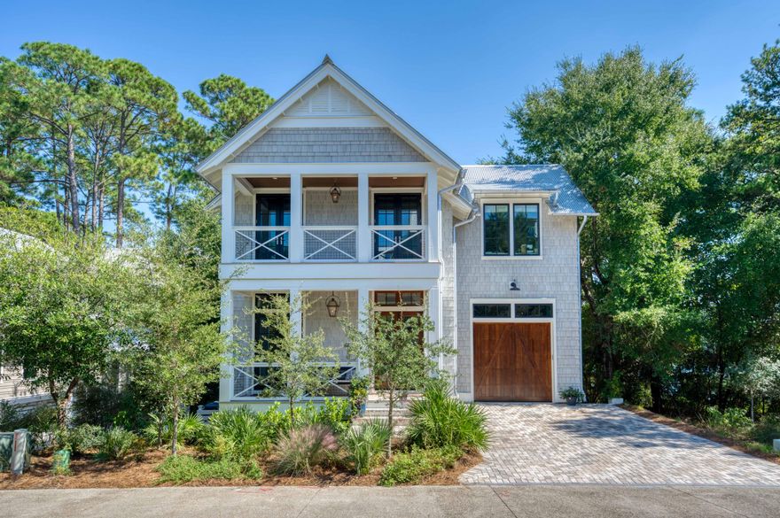 Stunning Geoff Chick designed home with Lake Views in the gated community of Draper Lake Coastal Village. This elegant retreat blends luxury craftsmanship with serene natural beauty, offering lake views and seamless indoor-outdoor living. Features include pecky cypress ceilings, Sub-Zero refrigerator, Wolf range, and a butler's pantry with wine cooler. Primary suites on both levels include relaxing porches overlooking the lake. Three fireplaces and multiple porches add warmth throughout. Enjoy a private pool, screened porch with outdoor kitchen, and dual outdoor showers. Smart home features, generator, and whole-house audio complete this refined coastal escape.