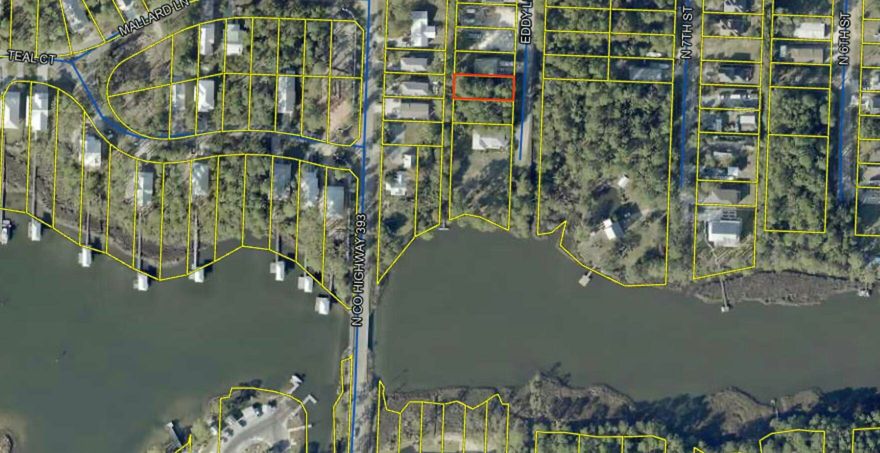 This .14-acre lot is just three lots from Hogtown Bayou, offering easy access to local boating with a boat ramp less than a mile away. Located within 10 minutes of the beach, it's the perfect spot to build your coastal retreat. Enjoy the serene community bayou, outdoor recreation, and proximity to all the Gulf Coast has to offer. A rare opportunity for those seeking a peaceful yet convenient location! Additional Photos to come after snow subsides.