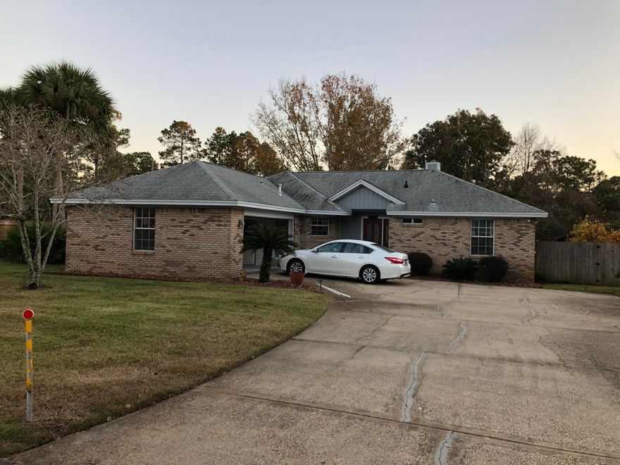 Welcome to this excellent neighborhood! This 3 bedroom, 2 bath home on a quiet street welcomes you to the front door with a covered entry with tile floors. Located in Meadow Woods minutes to the Mid-Bay Bridge, schools, shopping, and restaurants. Open concept with kitchen island open to the dining area. Kitchen highlights include white cabinets, tile countertops and back splash. Living room features a fireplace with custom surrounds flanked by built in shelving. Bedrooms are generous in size with ceiling fans, one with tile and the other with carpet. Both the master bath and guest bath have new granite counter tops and updated hardware.