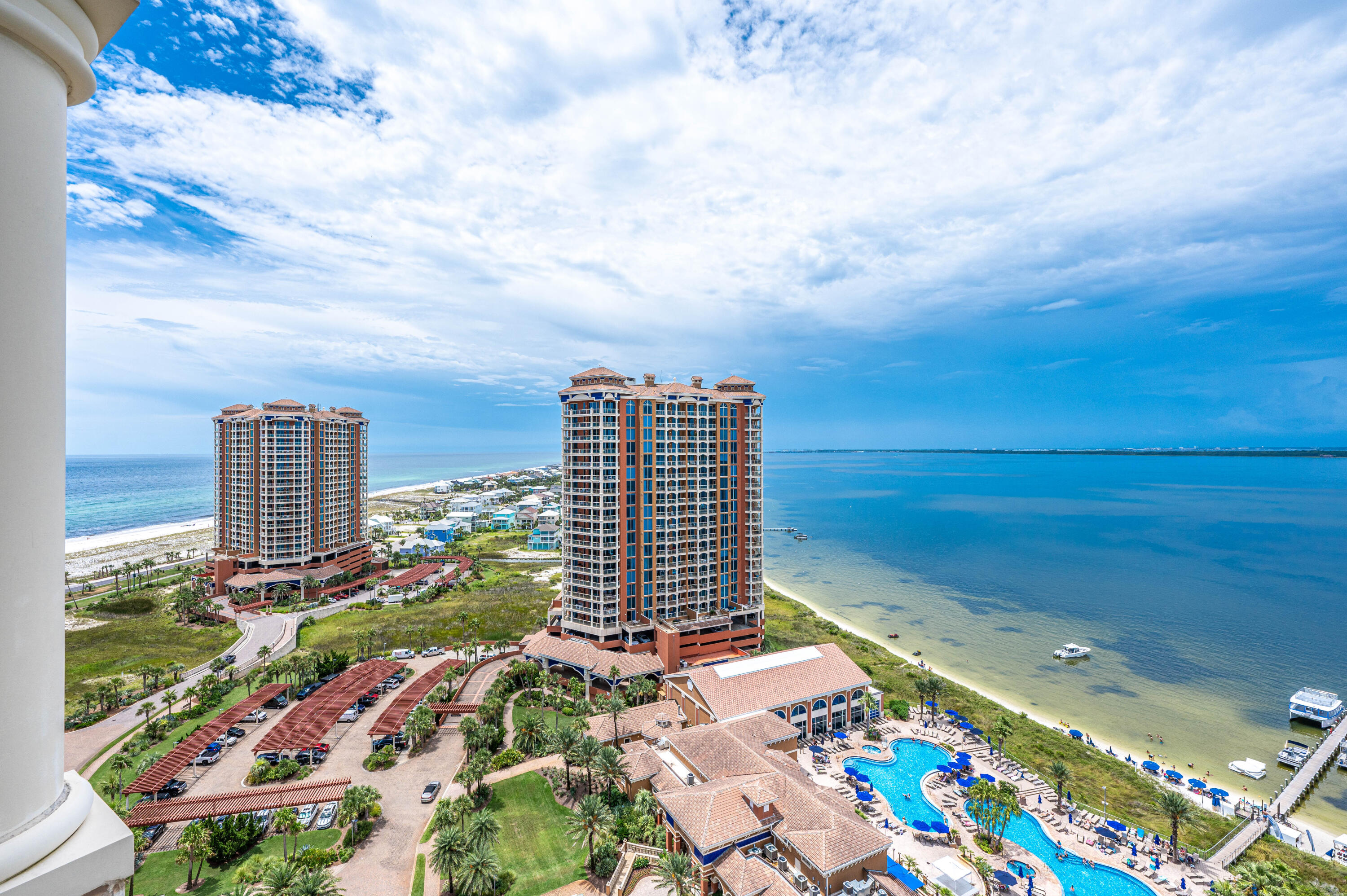 This immaculately maintained 2 bedroom Portofino unit on the 18th floor offers spectacular sound and Gulf views through floor-to-ceiling windows, tasteful furnishing and decor, and a spacious covered balcony. You'll enjoy views from both bedrooms, which both have access to the balcony and have abundant storage and closet space. This unit comes with an assigned covered parking space. Enjoy all that Portofino has to offer, such as a community pool (each tower also has their own pool), spa, gym, restaurant, and abundant activities for everyone in the family. The kids will love the floating water playground. You can also enjoy kayaking, paddle boarding, and jet ski rentals. It's just a short walk across the street to the Gulf. A perfect beach retreat and/or investment property. Other mentionab