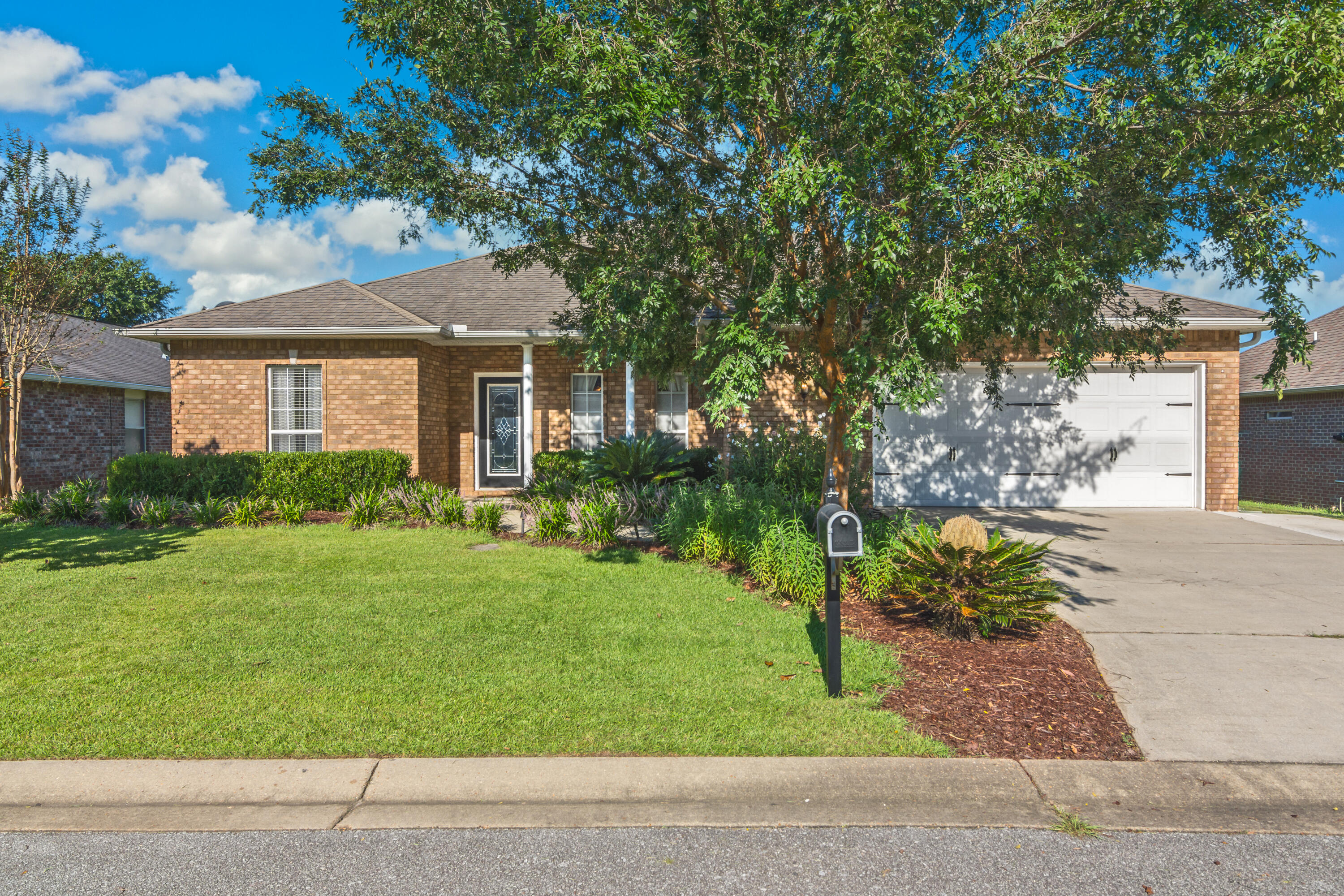 Welcome Home! This property sits in one of Crestview's southernmost communities, making a quick commute to area beaches, military bases, and the amenities of town. Pride of ownership abounds in this stunning home- walk in to be greeted by 10' ceilings and a roomy and open floor plan. Large formal dining room connects to both kitchen and living room. There is only carpet in the bedrooms- main area features engineered hardwood and tile. Functional kitchen has abundant wood cabinetry, granite countertops, and stainless steel appliances. Huge master suite- master bath has separate shower and clawfoot soaking tub. Backyard is fully fenced and has a covered patio in addition to large paver patio area. Other notable features of this property include updated hot water heater (2015), HVAC (2014),