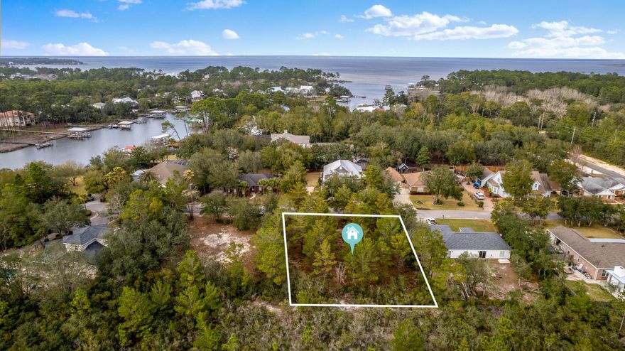 Beautiful lot with BOAT SLIP INCLUDED. Boat slip is maintained by the HOA but new owner will have use and personal access to it. This Lot is mostly cleared and in an ideal location. Backing up to conservation land and NEW golf cart path being constructed, will offer ease and access to 30A. This Property is close to the shops and dining at Grand Boulevard, SanDestin, and Sacred Heart Hospital. This lot comes with an assigned boat slip on Hewitt Bayou offering direct access to the Bay that is less that 1/4 mile. Great location for somebody that enjoys being on the water, and also a nice quiet, low density,  private neighborhood. The Lot is located in flood zone X. Lot dimensions are approximate and should be verified by buyer.