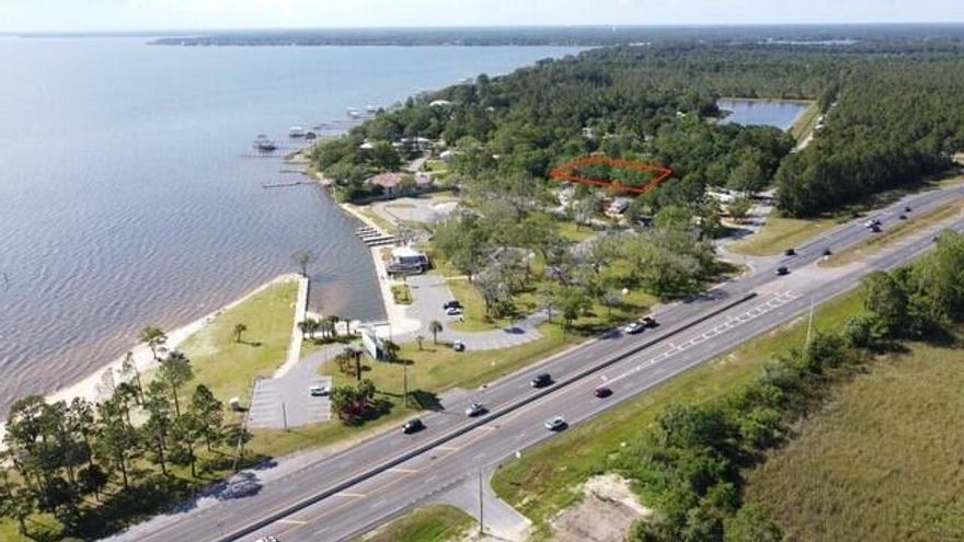 1.032 Acre lot. 3 lots split into 2 parcels. Don't miss your chance to own this exceptional lot in a prime bay location. Offering a tranquil retreat in a sought-after area, this property is a rare find in a vibrant coastal community. Buyers to verify any and all information deemed important to them.