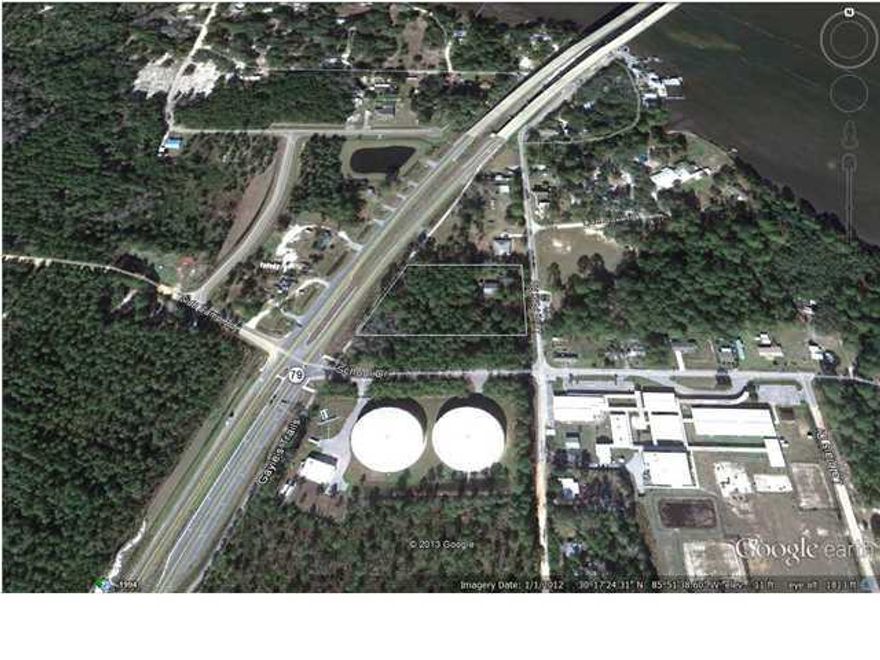 Owner Financing!! Rare 2.7 acres of General Commercial in West Bay. Just across the bridge from St. Joe's West Bay River Camps. Only 5-10 minutes from the beaches and the new airport. In addition, there is a small building that is currently leased month to month for $600.00. Estimated traffic count is 8700 AADT. Proposed planning http://tinyurl.com/khhfoo3