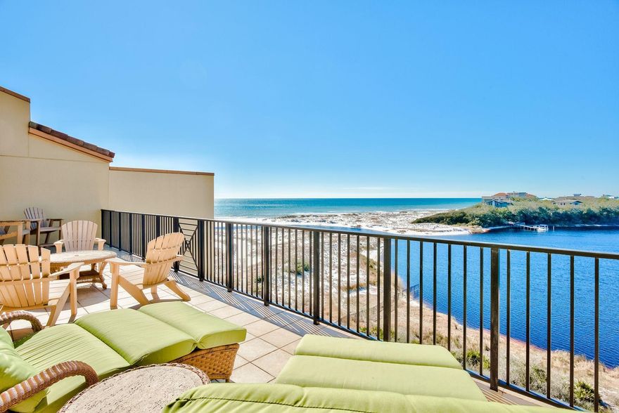 A luxurious vacation retreat, this elegant condo offers custom finishes, pristine amenities, and breathtaking views of the Gulf of Mexico and Big Redfish Coastal Dune Lake. A top-floor unit, this condo provides 3,154 square feet of living space with an open floor plan and four elegant suites. Thoughtfully designed, interior finishes include travertine flooring, custom lighting and high-end furnishings throughout. Perfect for those who love to cook, a spacious chef's kitchen features ample cabinetry, two large islands, granite countertops, and Viking appliances. Enjoy casual meals from the breakfast bar while a large dining area is ideal for gathering with family and friends. A wet bar features a custom backsplash and includes everything you need for preparing and serving drinks.