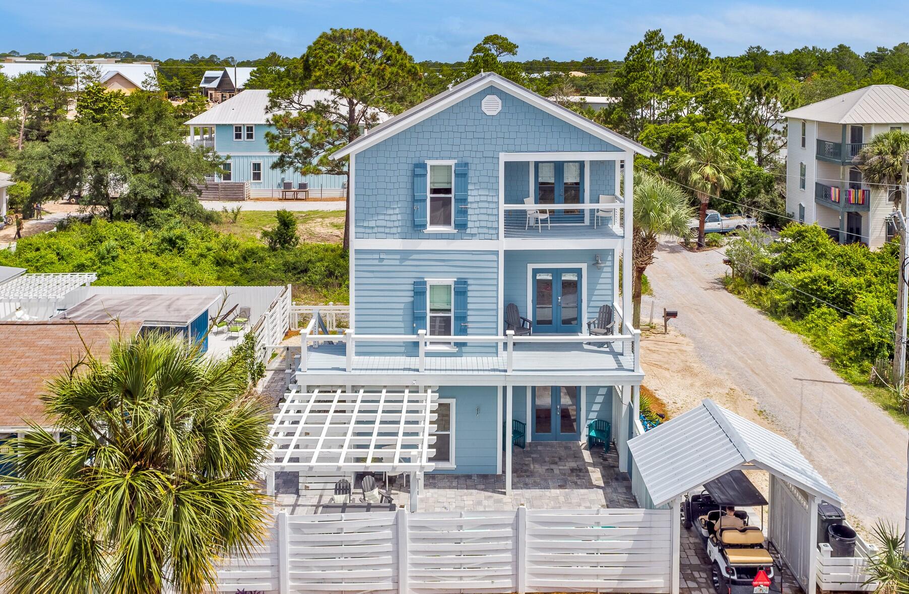 Beach Vacation Home Perfection South of 30A! Projections of $170,000! No HOA. Room for a POOL! A short walk to Eastern Lake Beach Access or the Ramsgate this home is ideal for vacationers and second homeowners, with just the right space to be together or apart. This home features a large and very private 1,500 sf fenced patio that is perfect for enjoying outdoor meals, corralling the kids, or washing off in the outdoor shower after a long day at the beach. From the first floor, you'll find the downstairs guestroom, a bunk room with