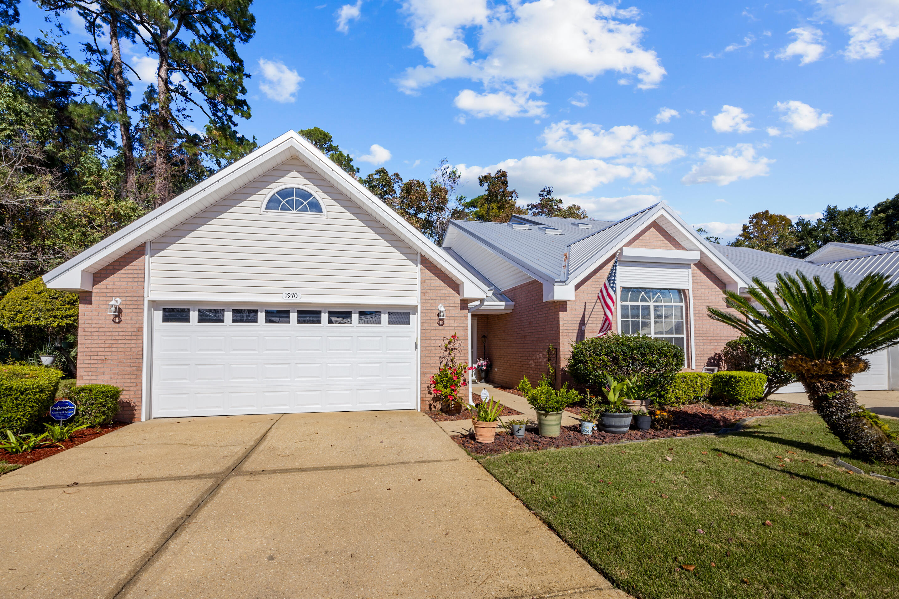 Welcome to this spacious all-brick, one-story end unit townhome located in a peaceful cul-de-sac, offering the perfect blend of comfort and convenience. With 3 bedrooms and 2 bathrooms, this home features a metal roof installed in 2018, ensuring durability and peace of mind. The property boasts a 2-car garage and an enclosed back porch that overlooks a serene preserve, creating an ideal retreat for relaxation.Inside, you'll find a beautifully landscaped home with a whole-house beam vacuum system, tile and carpet flooring, and elegant tray ceilings. The kitchen is a true highlight, featuring granite countertops, a breakfast bar, built-in desk, and a spacious pantry. Sliders from both the breakfast nook/dining area and living room lead out to the private porch, inviting natural light to fill the space.

The master suite offers a separate shower and garden tub, providing a luxurious retreat. Additional features include window treatments, a front storm door, and hurricane shutters for added protection. The HOA takes care of lawn maintenance, allowing you to enjoy a low-maintenance lifestyle.

This home is located in a no-thru-traffic neighborhood, ensuring a quiet and safe environment. Don't miss your chance to make this beautifully maintained townhome your own!