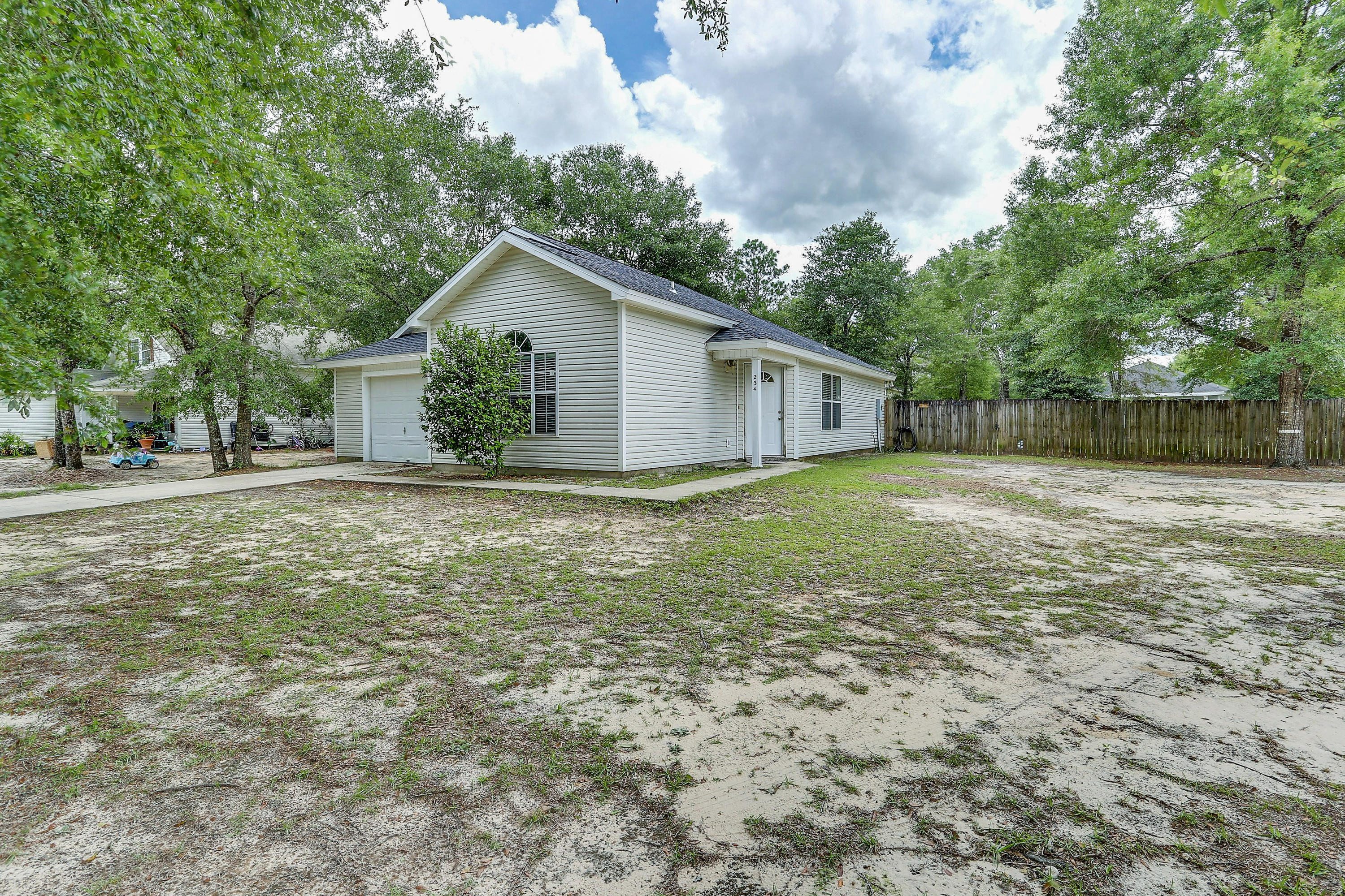 Loved family home for sale. 3 bed 2 bath house with a brand new roof and new flooring throughout on a huge corner lot. This split bedroom floor plan features tall vaulted ceiling, semi-open floor plan and a very generously sized back yard. This would be a great rental investment or starter home.