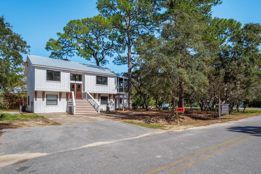 COMPLETELY REMODELED Home Situated on a 1/3 of an Acre. The split floor plan features master bedroom, kitchen and living room on the second floor. A 4 panel slider combines the living room with the screened in porch to enhance the living space for a perfect entertaining space. Shade by the old oak trees and majestic pines this home offers a very tranquil setting you don't normally find this close to the beach. With 2 public beach accesses and stalworth lake close by this is home is ideal for a primary residence or an investment property. The Carriage house has 2 bedrooms and 1.5 bathrooms completely separate giving you the chance to have rental income of around 2,000/month if rented out.COme view this property today! Everything is deemed to be accurate but should be verified by buy