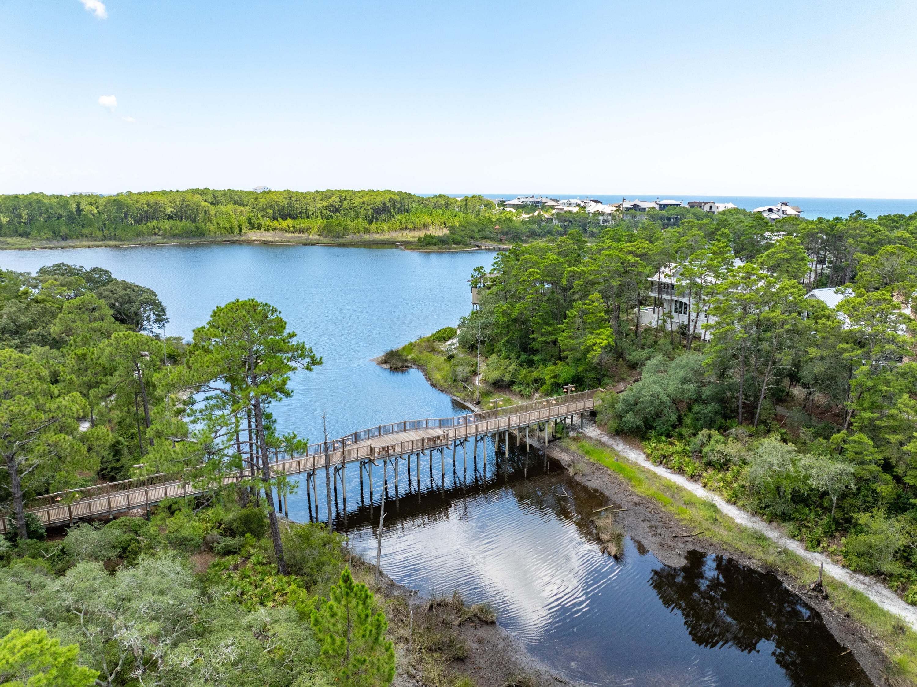 Gated, Private, one of the Jewels of Florida Emerald Coast and 1 of ONLY of 2 Homesites remaining in DRAPER LAKE NORTH. Draper Lake boasts a unique natural environment. Thistle Lane offers an Upscale, elegant home and is apart of the treasured 40 acre community with amenities carefully curated to take in the natural beauty of the lake, Gulf and wooded areas. Thoughtfully designed by the planners for the towns of Rosemary, Seaside, Alys with continuous Pedestrian trails through out the property, boat houses, access to the coastal dune lake and the Gulf of America, 48 foot observation tower ,two communities swimming pools, 45' observation tower, outdoor fireplace, Private beach Cabanas. You haven't lived until you have owned apart of DRAPER COASTAL VILLAGE , along the FLORIDA PANHANDLE.