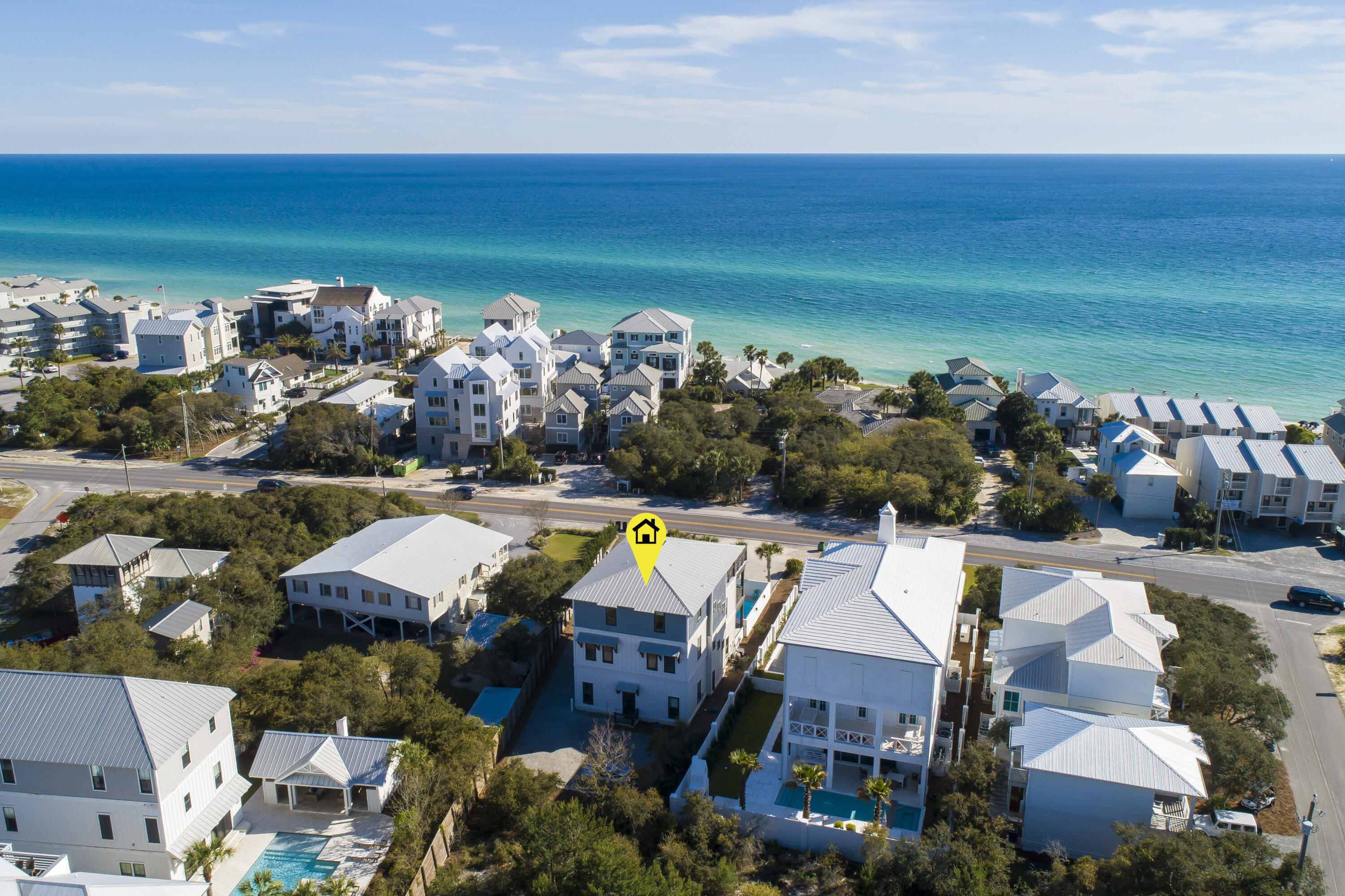 Indulge in coastal luxury at this exquisite retreat, ideally located within walking distance to the sought-after Alys and Rosemary Beach communities. With the capacity to accommodate up to 30 guests, this expansive residence promises an unparalleled vacation experience. Just moments away from the pristine white sands and emerald green waters of 30A, immerse yourself in the tranquil ambiance of seaside living. Upon entering, you're greeted by stunning herringbone wood tile flooring that sets the tone for the home's upscale ambiance. The chef's dream kitchen is a masterpiece of design, boasting top-of-the-line appliances including a 48'' gas range, custom vent hood, dual sinks, dual dishwashers, 3 ice makers, two microwave convection ovens, and 3 refrigerators. Luxurious finishes abound, from the waterfall stone accents to the etched mirrored cabinet doors. With a butler's pantry and ample storage space, entertaining is effortless and stylish. Each of the seven bedrooms offers a private sanctuary, complete with custom-designed beds, upholstered sofas, and high-density memory foam mattresses for ultimate comfort. The third floor is dedicated to entertainment, featuring dual TVs, air hockey, foosball, and an arcade game. A fully-equipped kitchenette ensures that refreshments are always at hand, while outdoor gas grills invite al fresco dining. Relax in the resort-style pool and unwind in the outdoor kitchen, perfect for hosting gatherings with family and friends. With its prime location and proven rental history, this property presents a lucrative investment opportunity. Whether you're seeking a profitable rental income or a personal retreat, this coastal haven offers the perfect blend of luxury and convenience to all that 30A has to offer. Schedule your private tour today!