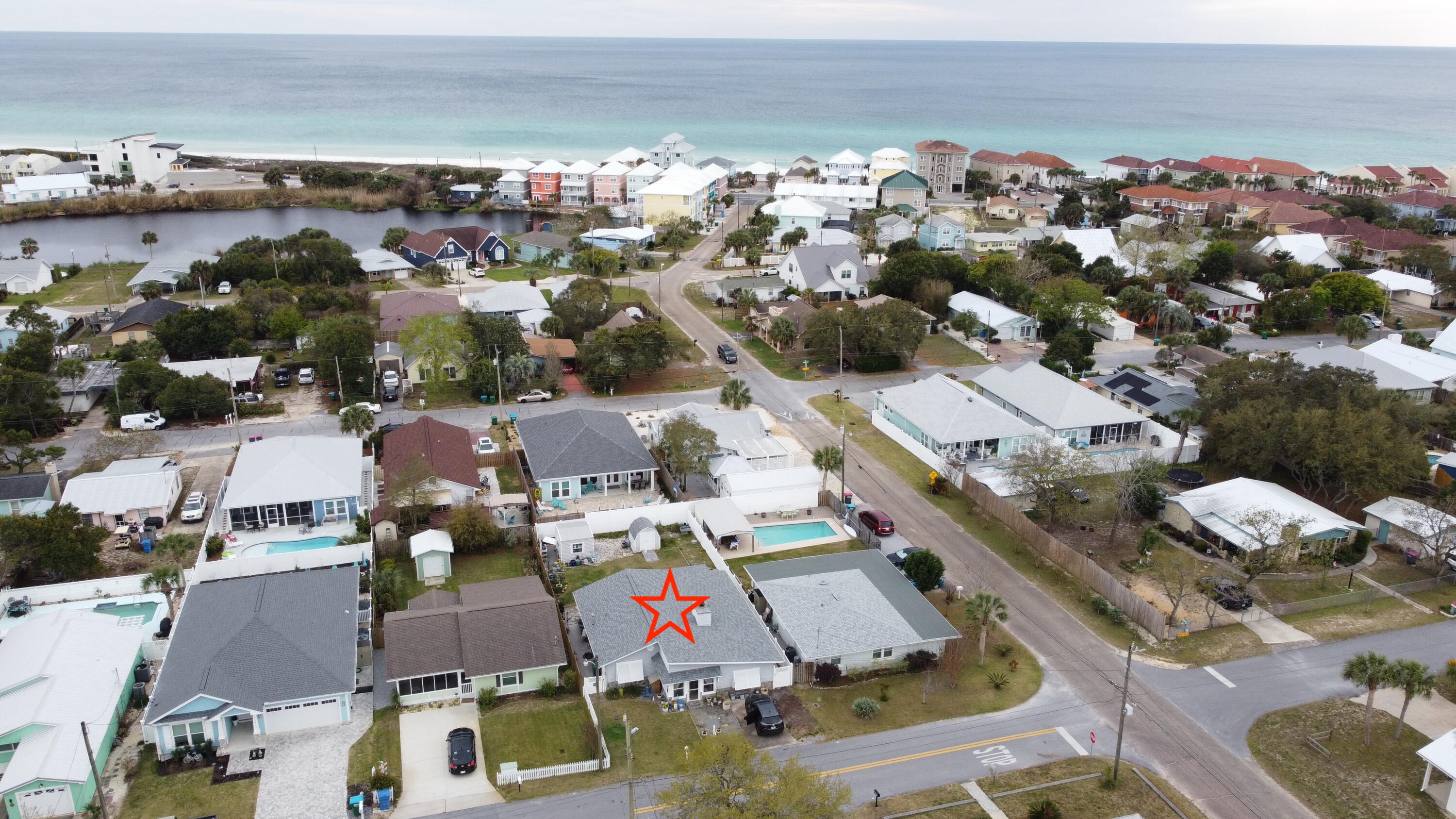 Have you been looking for that perfect 'beach life style' home? Something not too big, tucked away from all the 'noise' from Panama City Beach? Then this home is for you! With vacation rental projects as high as $41k/yr, this cozy two-bedroom home is a short walk or quick golf cart ride to your community's private gulf coast beach access. Enjoy those warm sunrises and breathtaking sunsets day in and day out living your ideal beach life. This home features hurricane doors & windows, glass enclosed sun room, tile flooring throughout, marble tub/shower & bath vanity. The kitchen has custom cabinets with granite counter tops, kitchen pantry w/pull out shelves, lazy Susan in cabinets, and a built-in wine rack. Blinds, shades, curtains, and all appliances remain with the home. Relax under the covered patio off the master suite! The out building includes power & light w/additional outlets, and there's also a well w/ a sprinkler system. There's no HOA, so this could be a perfect investment opportunity those looking to own a vacation rental. Call to schedule a showing today!