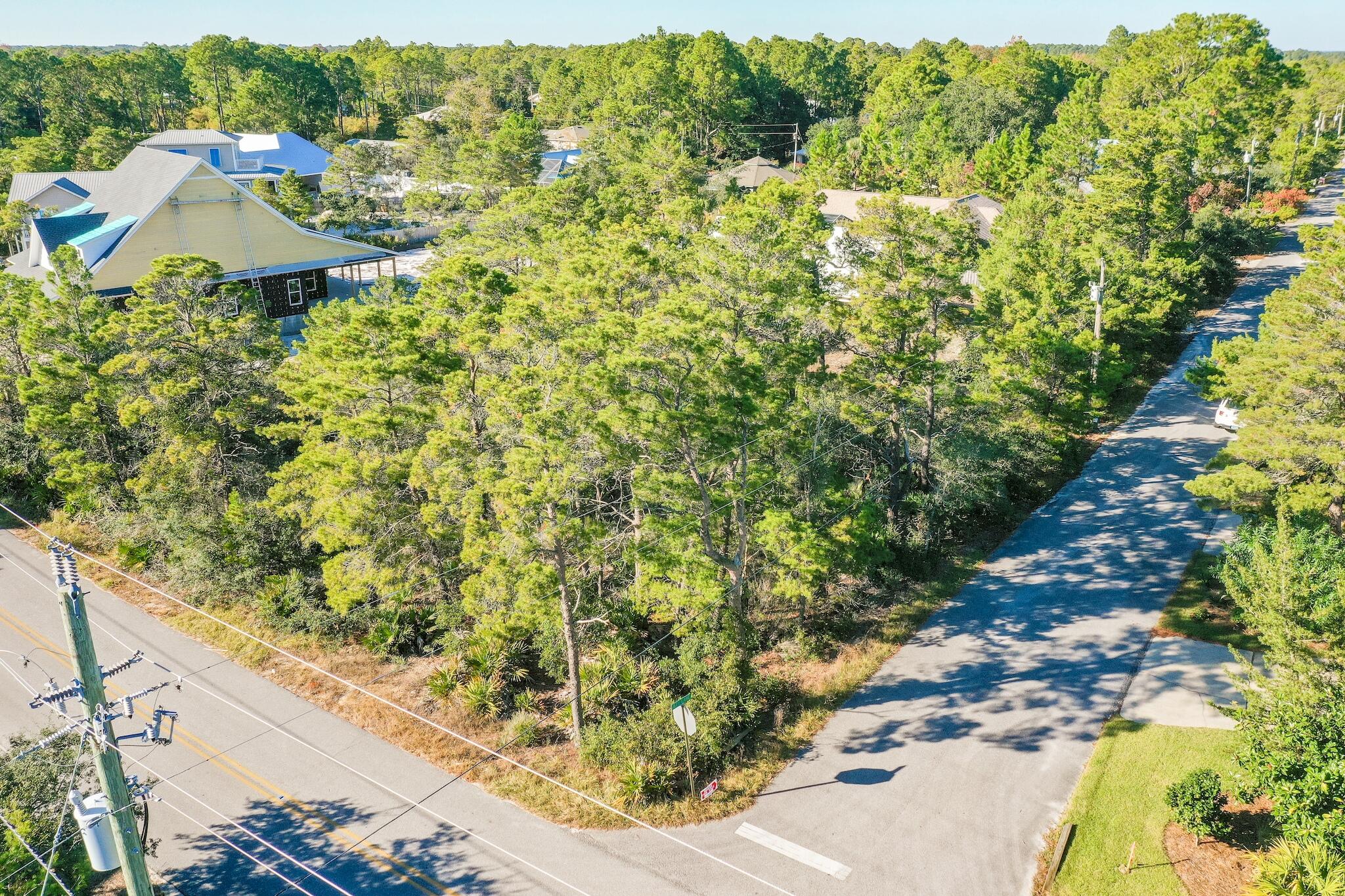 Phenomenal large corner lot less than a mile to the Gulf of Mexico. Closest beach access is Ed Walline Public Beach Access. Positioned on a high and dry lot in Santa Rosa Ridge with no HOA. Flood Zone X. This .34 acre lot is large enough to build a pool and circular driveway. This location is ideal for a primary, secondary, or investment rental property. Perfect location and close to shopping, dining, and entertainment at the Gulf Place Town Center.
