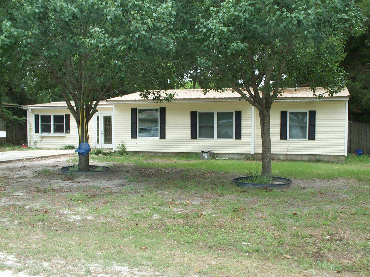 Completely Remodeled Interior in early summer of 2013... New windows, flooring, cabinets, countertops, bathrooms, painting, trim and much more.. New Metal Roof.. BR #4 separated from rest of bedrooms for privacy - BR #4 also ideal as an office/den... Huge MBR offers much privacy... Large entryway Foyer is perfect for greeting guest.. Spacious Laundry Rm off from Kitchen with Washer/Dryer included. Lovely Kitchen completely remodeled. Dining area open to Kitchen & LR... Big back yard that has a 100sf Wooden Deck.. Superb location and minutes to the beaches and shopping, but yet located in a neighborhood without any commercial type business - all homes.... Sellers loss is your gain - they just bought home 1 year ago for $147K, but military requirements dictate their move. See ''documents''