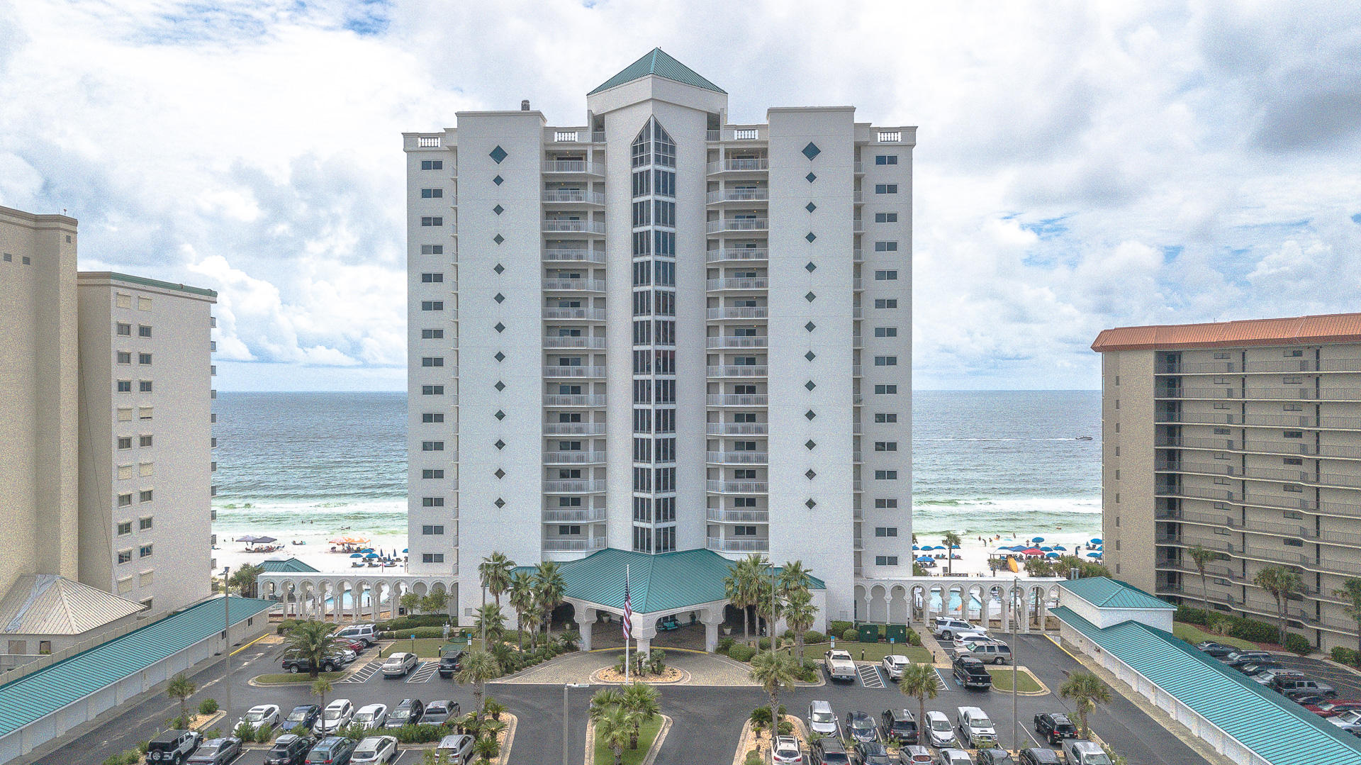 GULF FRONT 3BR/3BA Condo with DEEDED garage space in Upscale Princess Condominiums. Gated complex with only 74 condos and 325 feet of beach. The Princess portrays class & elegance from the moment that you see it from a distance. This complex is nestled among Palm Trees further back from the road boasting the tropical paradise that you have always wanted. Palm trees galore! Even beach front. Fabulous architectural design, tiled entrance up to front door, large columns, extra wide walkway behind complex. This very clean unit has a new ac & washer, hot water heater replaced recently, refrigerator, microwave, stove & carpets replaced within 2 years (carpet looks new. Unit has extra large laundry room with sink and cabinets, wet bar with refrigerator, custom cabinets with stainless hardware granite countertops, 3 FULL BATHS. Direct gulf front master suite opens to the very large, beautifully tiled balcony accessible from living area as well. Living & master suite have HANDICAP accessible extra wide sliding glass doors and windows that extend across the entire back wall of unit.
The complex features three swimming pools, one is heated inside of complex, hot tub, fitness center, game room, tennis court and basketball. This is the only 3BR unit listed in the complex. Don't miss out on your opportunity to purchase this Direct Gulf Front Tropical Paradise located on the World's Most Beautiful White Sand Beaches & Emerald Coastline. PCB has been voted #1 in 2018 for best vacation rentals. This complex is approved for VA financing. Virtual Tour under photo tab.