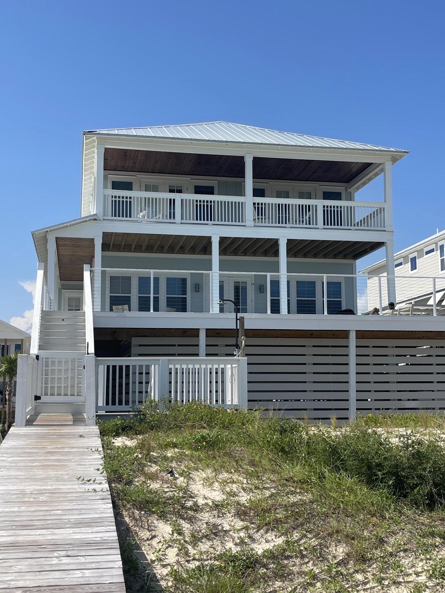 NEW 2023 CONSTRUCTION! ELEVATED POOL WITH OCEANFRONT VIEWS!With two large decks overlooking the Gulf, your own private pool, and the sugar sand beach and clear blue water just feet away, Donsol Beach House is the perfect vacation spot in the Villa del Sol subdivision. This 3,300 square foot 5 bedroom 5 bath vacation home with an elevated pool and elevator was built in 2023 in a lovely private gated subdivision.Donsol truly captures the essence of all things coastal. You will be greeted with a large, open concept living and kitchen space boasting spectacular Gulf views. Take a step through the back doors facing the ocean to find yourself in the peaceful, breezy surroundings with an amazing, unhindered view of the Gulf and your own private elevated swimming pool.