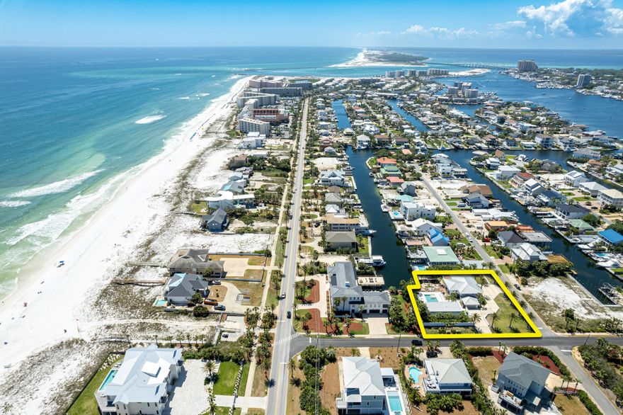 DEEP-WATER on Holiday Isle across from Dedicated Beach Access! 620 Magnolia Drive exemplifies the distinctive and timeless Mid-Century Modern style throughout this spectacular waterfront estate, located on the exclusive Holiday Isle of Destin, Florida.  This property has been meticulously renovated and expanded into a resort-style compound featuring a phenomenal cabana home alongside the expansive ~18' x 33' heated pool and 8-person hot-tub, multi-tiered pool deck pavilion, poolside lanai, glass balustrades, high quality artificial turf, and enlargeable deep-water dock, slip, and boat lift.  The result of this magnificent project is one of Holiday Isle's most elite addresses, oriented in convenient proximity to the deeded beach access afforded to the fortunate owners of this low density.. ...waterfront community.
The fabulously creative hardscaping and landscaping accentuate the stunning elevations of this architectural masterpiece, surrounded by a beautiful white concrete wall. 
The interior is undeniably one of the most impressive, featuring extraordinary features and finishes throughout, and a fully furnished, accessorized, and electronically equipped opportunity that will enable you to instantaneously enjoy the gorgeous Emerald Green waters and world-class beaches indicative of this most special town in the great State of Florida, where the sensational lifestyle is unrivaled in our Country.  The spaciousness of the interior and exterior of both the main home and the cabana home will accommodate large family gatherings and display unforgettable ambiance during the evening hours with all the beautiful accent lighting, all enjoying a very private setting.  The extensive natural illumination of sunlight everywhere in both homes will make your mind and body feel so refreshed, especially after spending time in the fitness studio (which overlooks the pool pavilion) working out or meditating.  Ownership of this fine, unique estate will replicate the feeling that you experience like that at a 5-star resort.  Please inquire for further details and to schedule a private showing. 
