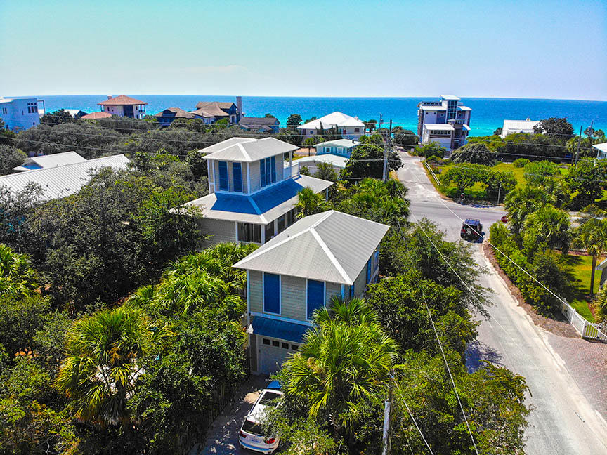 This beautiful Beach House is just 100 yards from the beach, and less than a mile from Seaside. An incredible income property with 18 years of established rental history, many guests returning year after year, and 2019 Gross Rental Income of $131,650. This home has been immaculately maintained including all new kitchen appliances, countertops, and first floor furnishings in 2018, all new HVAC units in 2017 and will be repainted in fall 2019 . The property includes a 1-bedroom carriage house with living area & kitchenette, 1384 square feet of wrap-around covered porches, and an oversized heated pool in the private courtyard. From the main house's 3rd floor tower deck, you can enjoy gulf views plus views of Seaside's rooftops & beautiful sunsets over the Gulf.