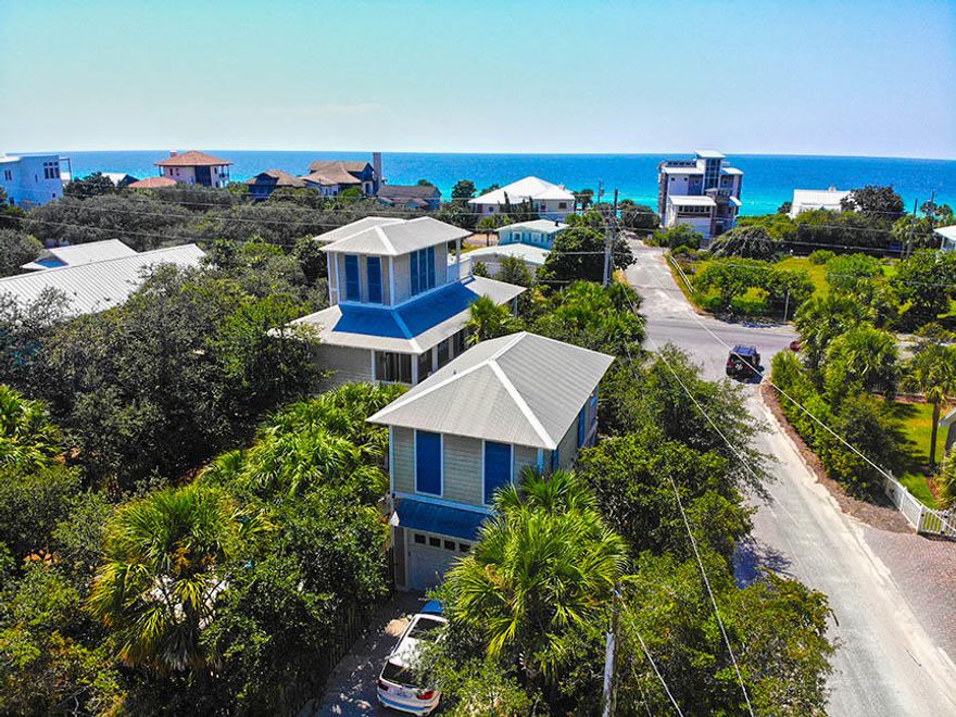 This beautiful Beach House is just 100 yards from the beach, and less than a mile from Seaside. An incredible income property with 18 years of established rental history, many guests returning year after year, and 2019 Gross Rental Income of $131,650. This home has been immaculately maintained including all new kitchen appliances, countertops, and first floor furnishings in 2018, all new HVAC units in 2017 and will be repainted in fall 2019 . The property includes a 1-bedroom carriage house with living area & kitchenette, 1384 square feet of wrap-around covered porches, and an oversized heated pool in the private courtyard. From the main house's 3rd floor tower deck, you can enjoy gulf views plus views of Seaside's rooftops & beautiful sunsets over the Gulf.