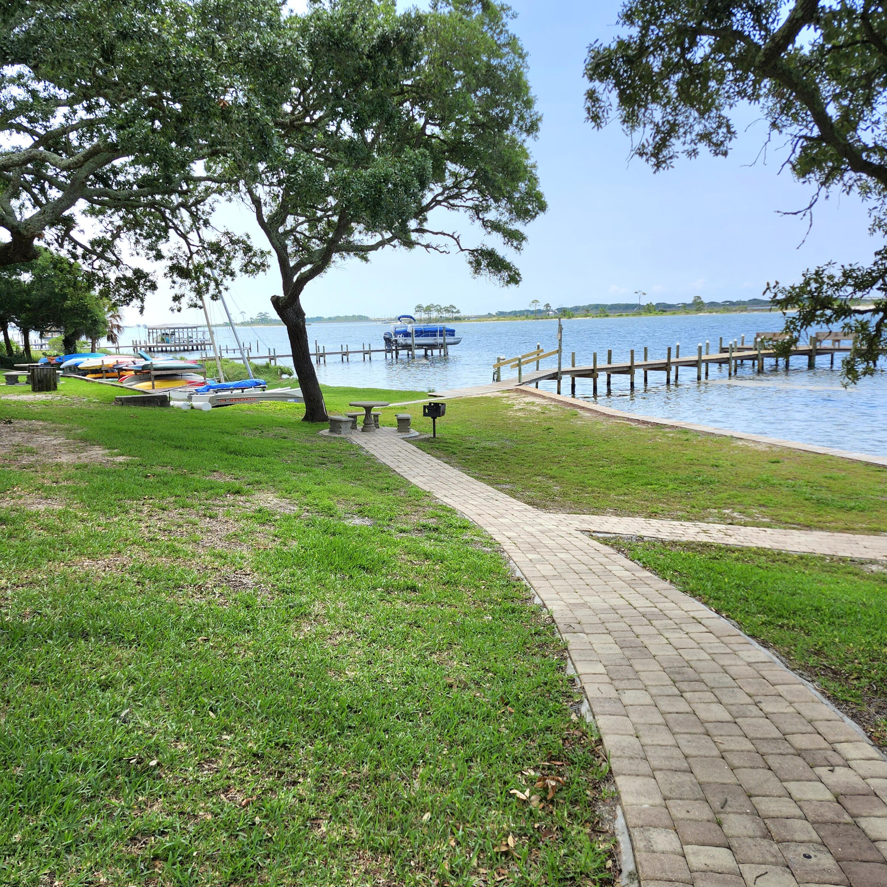 Great deal on one of the nicest units at Cedars. Beautifully and uniquely renovated unit in a waterfront complex. Located on the Intracoastal Waterway this complex offers a dock, fishing, waterfront pool and small craft storage. Launch your canoe, kayak or waverunner from the shore and enjoy the Florida lifestyle. Pretty walk-in tile shower. Modern kitchen features granite counters and glass tile backsplash. Newer windows and sliding door. Fantastic waterfront with a large grassy area and mature trees for shaded picnic area. Convient to Hurlburt, Eglin and the white sand beach of Okaloosa Island and Destin. Owners can have 2 pets weighing 20 lbs or less. This unit would make a great home or investment with short term rentals allowed.