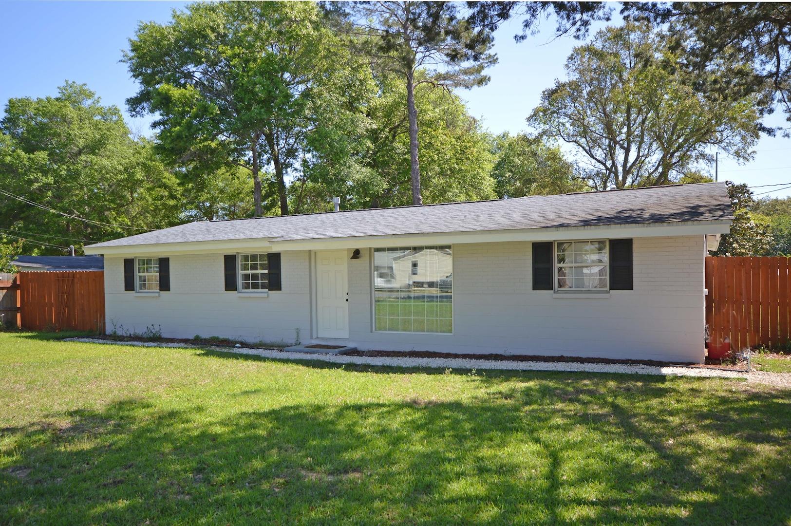4 Bed, 2 Bath Newly Renovated Spacious Fort Walton Beach Home.Across your large, sprawling green lawn and oversized driveway, fit for an estate, awaits your recently renovated home. Upon entering, a large paned picture window sheds natural light on your new laminate floors and crown molding. To the right is the master bedroom complete with large walk-in closet and a newly tiled master bathroom. Through the open floor plan of the living room is the kitchen featuring stainless steel appliances, hooded gas range, granite countertops and tiled backsplash. Past the kitchen is a second, large living area. This bonus room has double-door access to a new deck and the backyard- one of the larger lots in Fort Walton Beach-completely surrounded by a privacy fence.