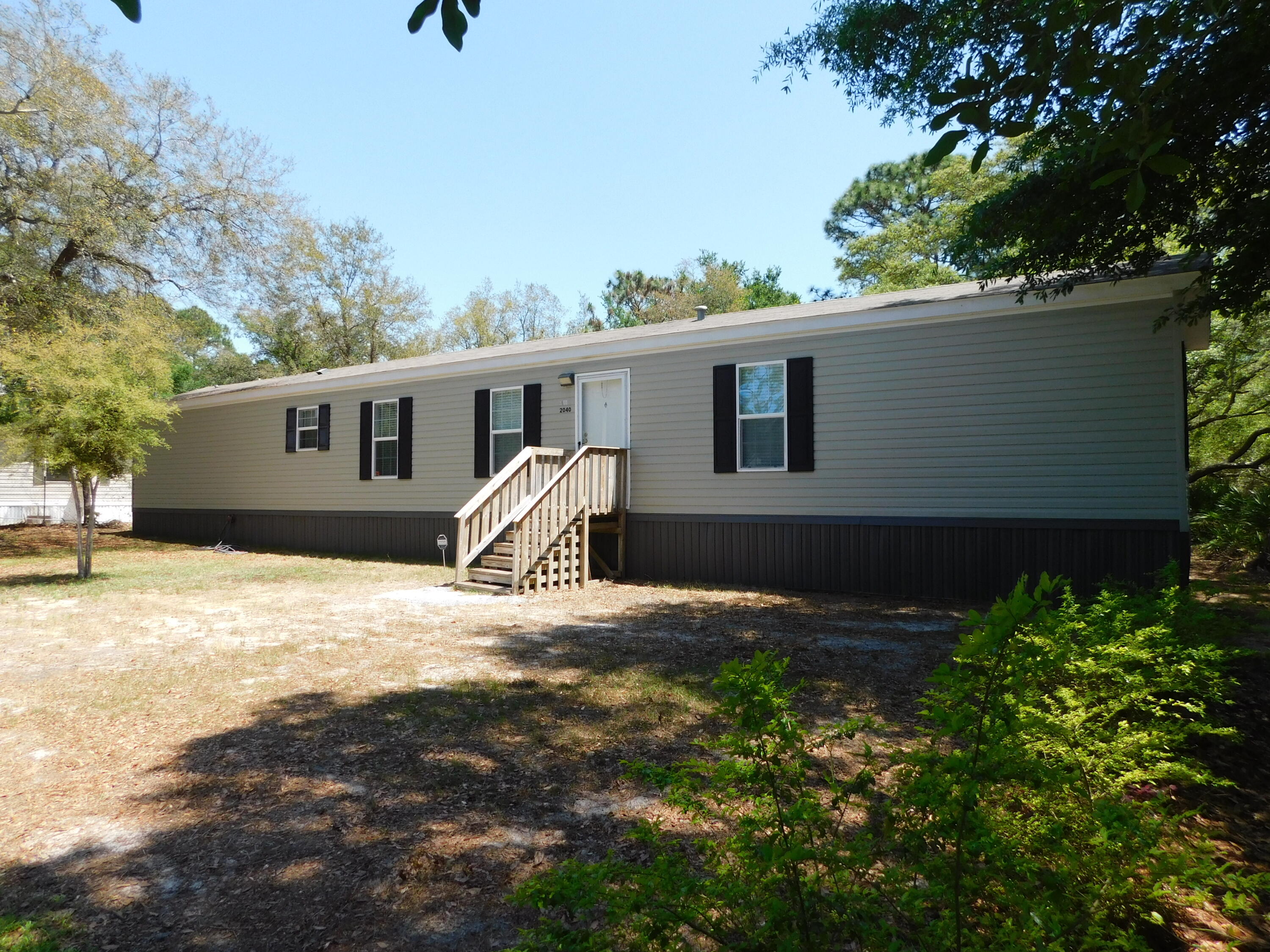 Very nice, like new 3 bedroom , 2 bath Sanders manufactured home. Although this home is a 2017 , it was only lived in a few months. The beautiful yard is totally fenced and with nice shade trees so no problem for pets and children. Just minutes to the Beach, Hurlburt and Shopping! All appliances convey , including washer and dryer but all furniture will be removed before closing.All information deemed to be correct, buyer to verify.