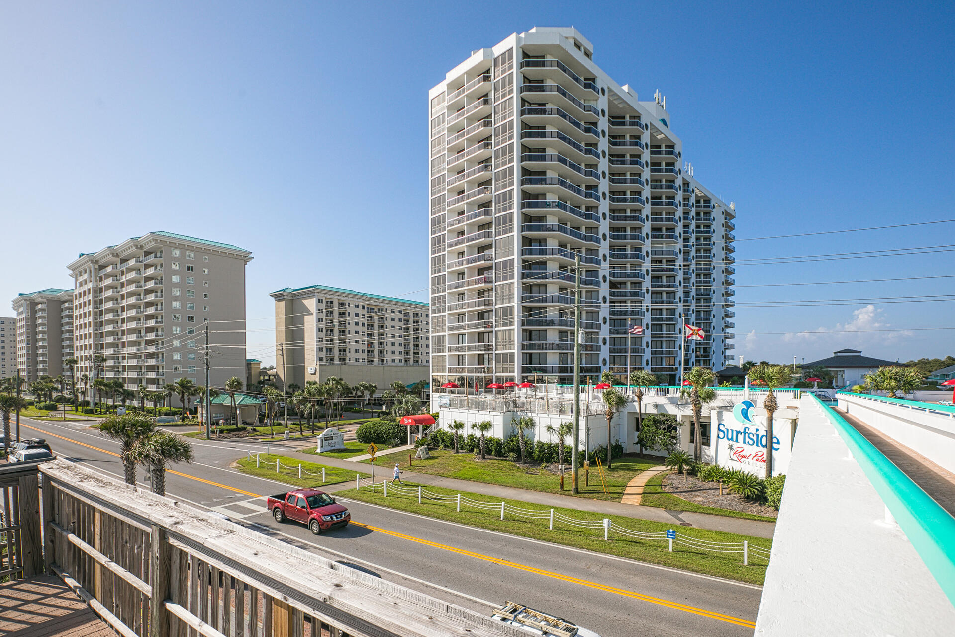 Gulf AND Bay views from this stunning 10th floor corner unit with wrap around balcony and floor to ceiling sliding glass doors.  This renovated and meticulously maintained 3-bedroom, 3-bath condo is being sold fully furnished. The kitchen and baths are beautifully updated with white cabinets, granite countertops and modern tile.  Open concept layout with remote controlled shades in the living/dining room. No carpet here..ceramic tile floors throughout.  Beautiful interior coastal furnishings and each balcony has quality poly-wood outdoor furnishings. The lockout layout allows it to be rented as a 2 bedroom and a 1 bedroom each with balconies and views of the gulf and/or bay.  2023 grossed $76,966 and 2024 has grossed $62,263 to date. This complex is a true Resort, loaded with amenities such as a restaurant, covered parking, fitness center, spa/hair/nail salon, exercise room, heated pool, kiddie pool, hot tubs and saunas. Basketball courts, tennis courts and pickleball courts.  Deeded beach access with tiki bar at the pool.  And beach bonfires on Friday nights!   Take the skywalk to the beach or the many restaurants along scenic highway.  Shopping minutes away!  HVAC in unit 1012A new in 2023.  HVAC in unit 1012 new in 2019. Building is on boiler system so no hot water tanks in units.  