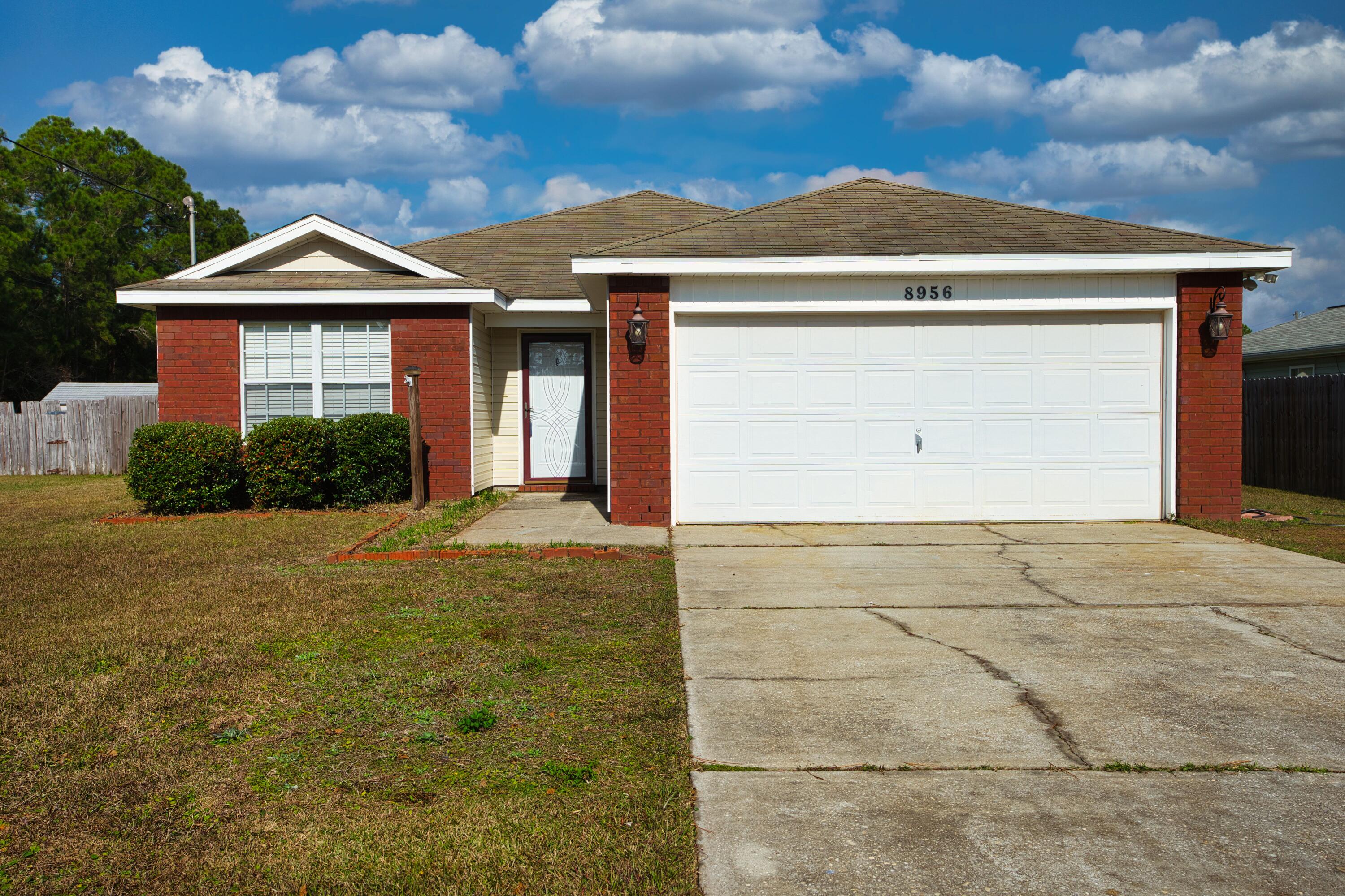 Welcome home! This beautifully updated 3-bedroom, 2-bathroom home in Navarre is move-in ready! Featuring a newly renovated kitchen with modern finishes, stunning new flooring throughout, and fresh paint that brightens every space. The open floor plan offers seamless flow from the kitchen to the living and dining areas, perfect for entertaining. Spacious bedrooms provide comfort, while the primary suite boasts an ensuite bath for added privacy. The open backyard is ready for summer BBQs or relaxation. Just 4 miles from Navarre Beach, close to local shopping, and ''A''-rated schools--don't miss this gem! Schedule your showing today!