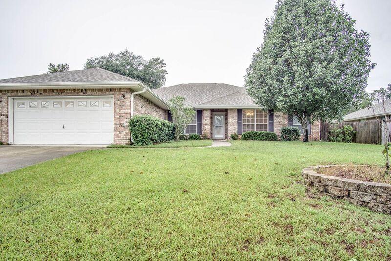Are you looking for an immaculate all brick home with mature fruit trees, a large open floor plan, and a large lot? Then look no further! This 4 bed 2 bath home is in immaculate condition! This home boasts a huge living area that includes a fireplace, an enormous eat in kitchen, formal dining area and flex room, over sized bedrooms with like new flooring, his and her walk in closets in the master, and a beautiful master bathroom. PLUS mature trees in the yard produce so many peaches you'll be giving them away! Come see this amazing home in person, you will be glad you did!