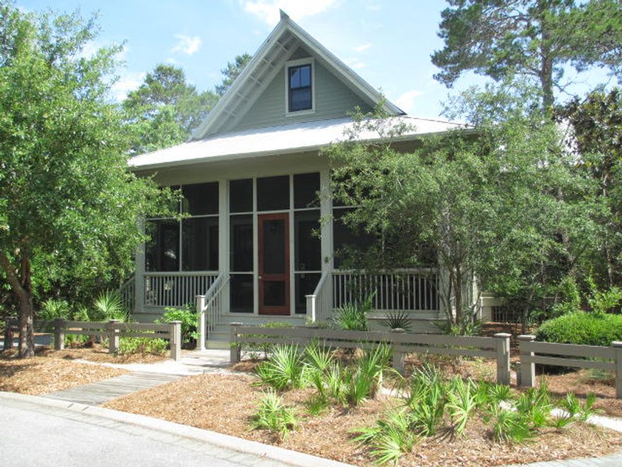 Centrally located in the Camp District to all the wonderful Watercolor amenities, this spacious 2 story Florida cottage has it all - including front and rear screened porches and extra large deck with a grill/bar area. The large living room with vaulted ceilings is located on the 1st floor as well as the master and a guest bedroom. Also on the first floor is a well equipped kitchen which includes professional appliances and a full size laundry room with counter space, a large sink, washer & dryer. Two additional bedrooms are located upstairs as well as a private desk area that can be used as a workspace. This home backs up to a beautiful wooded nature preserve and is built for ultimate relaxation and entertainment. Sold Furnished.