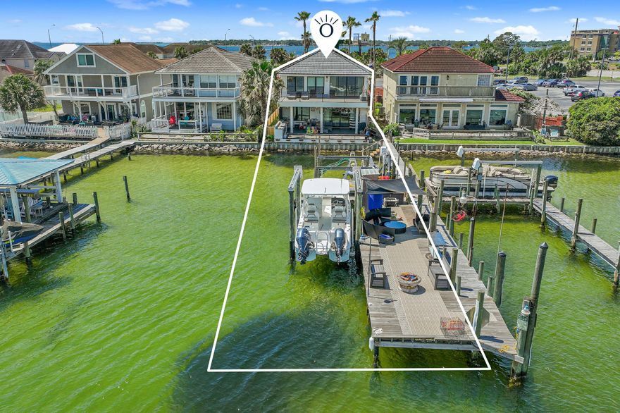 Tucked behind the gates of Lighthouse Pointe, this beautifully renovated Fort Walton Beach home is designed for those who want to spend more time on the water and less time on yard work. Featuring 2 boat lifts, a jet ski lift, and a walk-out dock, your days can begin with a swim, a paddle, or a boat ride. Inside, you'll love the thoughtful updates throughout this home, from the sleek finishes to the open layout that flows effortlessly to the outdoors. The Trex deck and outdoor kitchen make entertaining easy, and evenings by the outdoor fireplace are what Florida dreams are made of. The primary suite is a true retreat, with sweeping water views, a fireplace, a soaking tub, and a spacious open shower.  Grab your blue crabs from the trap for dinner, or take a quick ride to Crab Island.... there's endless opportunities for recreation on the water or simply taking in the spectacular views of the bayou. Lighthouse Pointe is in close proximity to Eglin, Hurlburt, and the Fort Walton Beach Medical Center. 