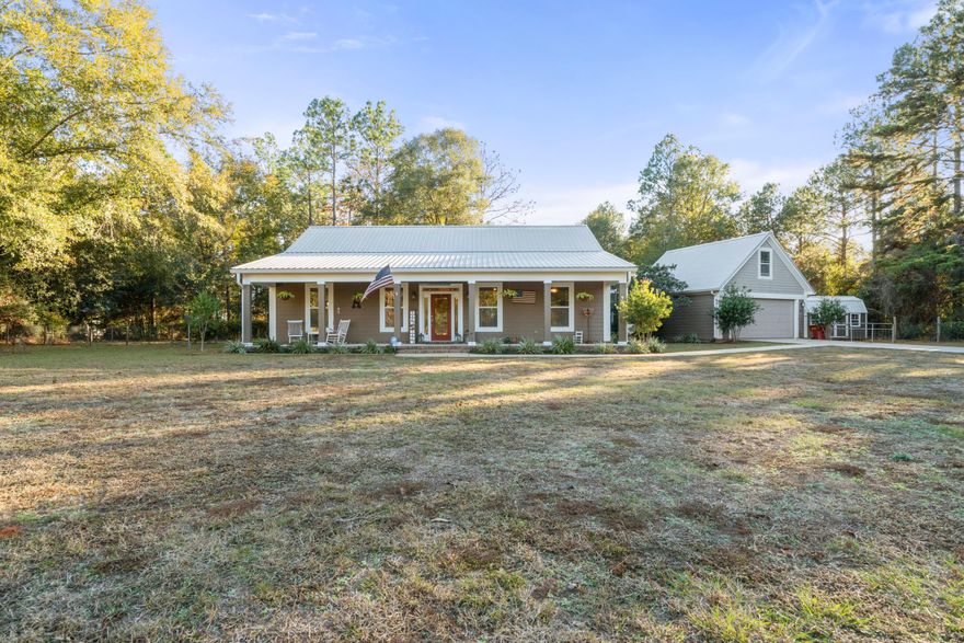 You Have to Come and look at this Wonderful Custom Built Home! This home was built to building codes to those homes on our coastline, from the 5/8'' re-bar foundation,Very Durable James Hardie siding, to the Metal roof that has the thickest gauge metal available. Your first view is the fully landscaped yard up to the 48' cover front porch, pull up your rocking chairs and stay a while. Entering through the front door is the Living Area with Cathedral Ceilings and recessed lighting. Manchester Hand Scraped Wood Flooring in the Living Room,Kitchen,Dining and Master Bedroom. Large tile in Bath Areas,Laundry and Breezeway. All windows have Plantation Blinds that will convey. All Interior Doors are solid filled doors. Custom Crown Molding and every Door and Window have been cased, even the
