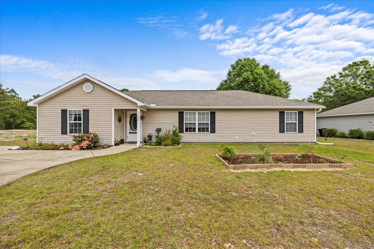 This home is a must see! The open-concept floor plan provides a bright, airy feel, with a spacious, vaulted ceiling in the main living space. A stylish shiplap feature wall and contemporary luxury vinyl plank (LVP) flooring add character and durability.The kitchen is designed for style and efficiency, offering tile flooring, a farmhouse sink, rustic brick backsplash, sleek countertops, a custom-built breakfast bar, and a spacious walk-in pantry. All stainless-steel appliances, including a gas range, are included--ready to support everyday cooking or weekend entertaining.The primary suite is tucked away on one side of the home. This tranquil space includes updated LVP flooring, a trey ceiling enhanced with shiplap, and an en suite bathroom that features a double vanity and a massive walk-in closet. The additional bedrooms are beautifully updated with LVP flooring and include large closets for storage.
Adjacent to the kitchen, a generous laundry room provides plenty of function, enhanced by a custom brick accent wall and floating shelves for storage and decor. The second bathroom is finished with a beautiful walk-in shower featuring classic subway tile and a built-in bench for added comfort.
A standout feature of this home is the sunroom, perfect for relaxing or nurturing your green thumb. With lighting, ceiling fans, and waterproof LVP flooring, it's a versatile space you can enjoy year-round.
The backyard is designed with entertaining in mind. An impressive 18x38 deck offers built-in seating, accent lighting, and a covered zone for grilling or dining outdoors. Attached is a 12x28 double-loft shed that's fully insulated, wired with electricity, and climate-controlled via a ductless HVAC unitideal as a guest suite, workspace, or studio. The fenced-in yard also includes a separate shed for storage or workshop use and a stone fire pit to gather around on cool evenings.
Every element of this property combines utility with comfort, making it a truly special place to live. Schedule your showing today!
