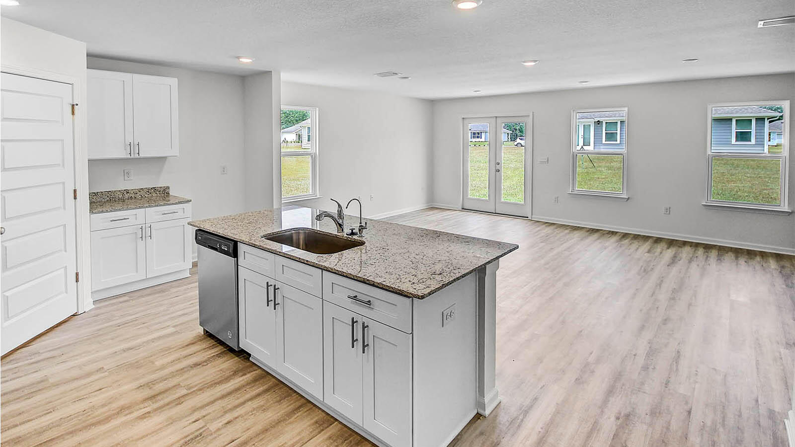 Welcome to 216 Eunola Lane, a new home at Ashton Park Phase III in Freeport, Florida. This home is ready for move in and features the Lismore floor plan. The foyer opens to a bright living space, with two secondary bedrooms and a full bathroom tucked off to one side. These rooms are perfectly sized for guests, children, or even a home office, with each offering plenty of closet space and easy access to the shared bath. This home featuring modern finishes and engineered Vinyl plank flooring throughout the home except for the bedrooms where you'll find plush carpet.