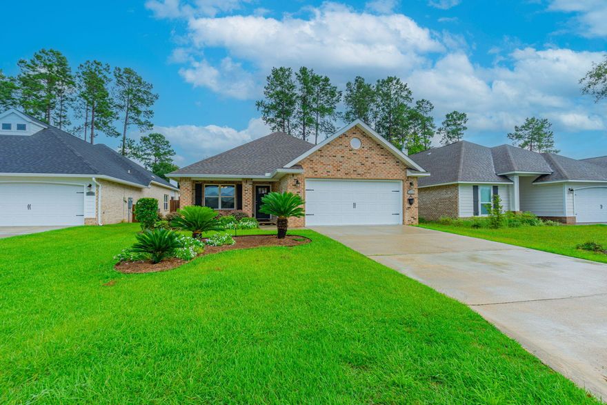 ASSUMABLE VA loan at the low rate of 2.75% offered to qualified VA buyers and the SOLAR panels will be PAID OFF by sellers. This immaculate, like new and beautifully maintained, one story home is in the desirable gated  subdivision of Stonechase, just steps away from the community park. Built in 2022, by Celebrity Builders, this Gaslight floor plan blends modern amenities with thoughtful design and attractive finishes. A welcoming covered front porch leads into the entry foyer with a formal dining (or office) area opening up to the spacious, vaulted-ceiling Great room. The well-appointed kitchen features new Quartz countertops, a breakfast bar, pantry and stainless steel, Energy Star(r) appliances.  A generously sized Primary Suite features a spa-style ensuite bathroom with a double granite topped vanity, large shower and roomy walk in closet. Two additional bedrooms down the hallway, share a full guest bathroom. French doors lead to the covered back patio and the pretty, professionally kept yard with sprinkler system, which will make your morning coffee and evening cocktails a pleasure! The Solar panels, which the seller will pay off -  will give you BIG savings on your power bill year-round, whilst whole home Gutters, Fabric Hurricane shutters and a two-car garage with finished Epoxy flooring complete the package. This home offers an excellent combination of modern design and energy-efficient comfort and a quiet, gated-community in the highly rated PACE School district. Don't miss the opportunity to make this lovely craftsman home your own.