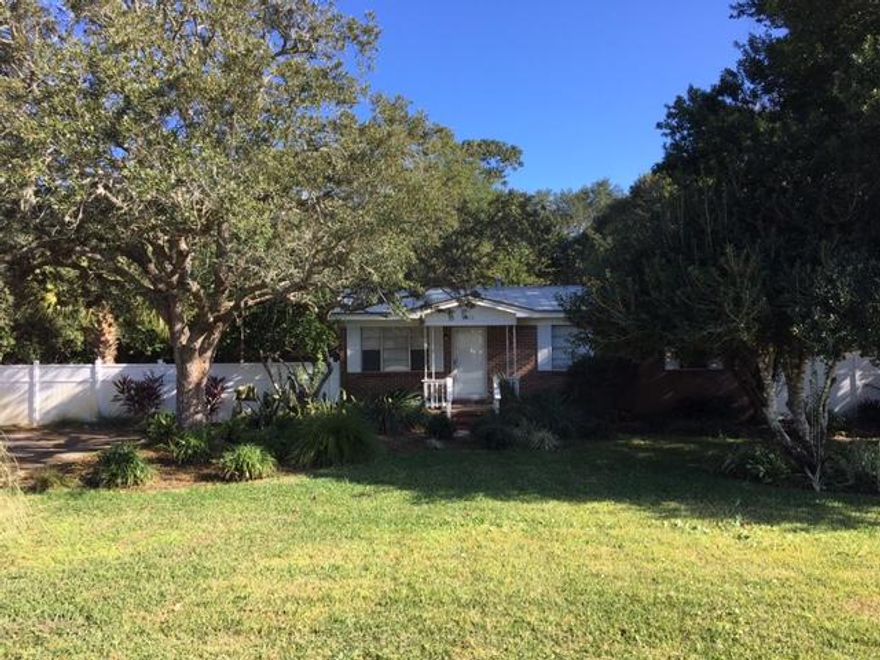 Charming ALL brick home just blocks from Destin Elementary in one direction and to the Mattie Kelly Park and Nature Walk or Joe's Bayou Boat Launch in the other. This beautifully landscaped home has a large fenced in backyard with irrigation system, renovated kitchen with new cabinets, upgraded lighting and granite counter tops. Tile throughout living areas and brand new carpet in bedrooms! New metal roof installed in 2011. New HVAC Apr/2015.