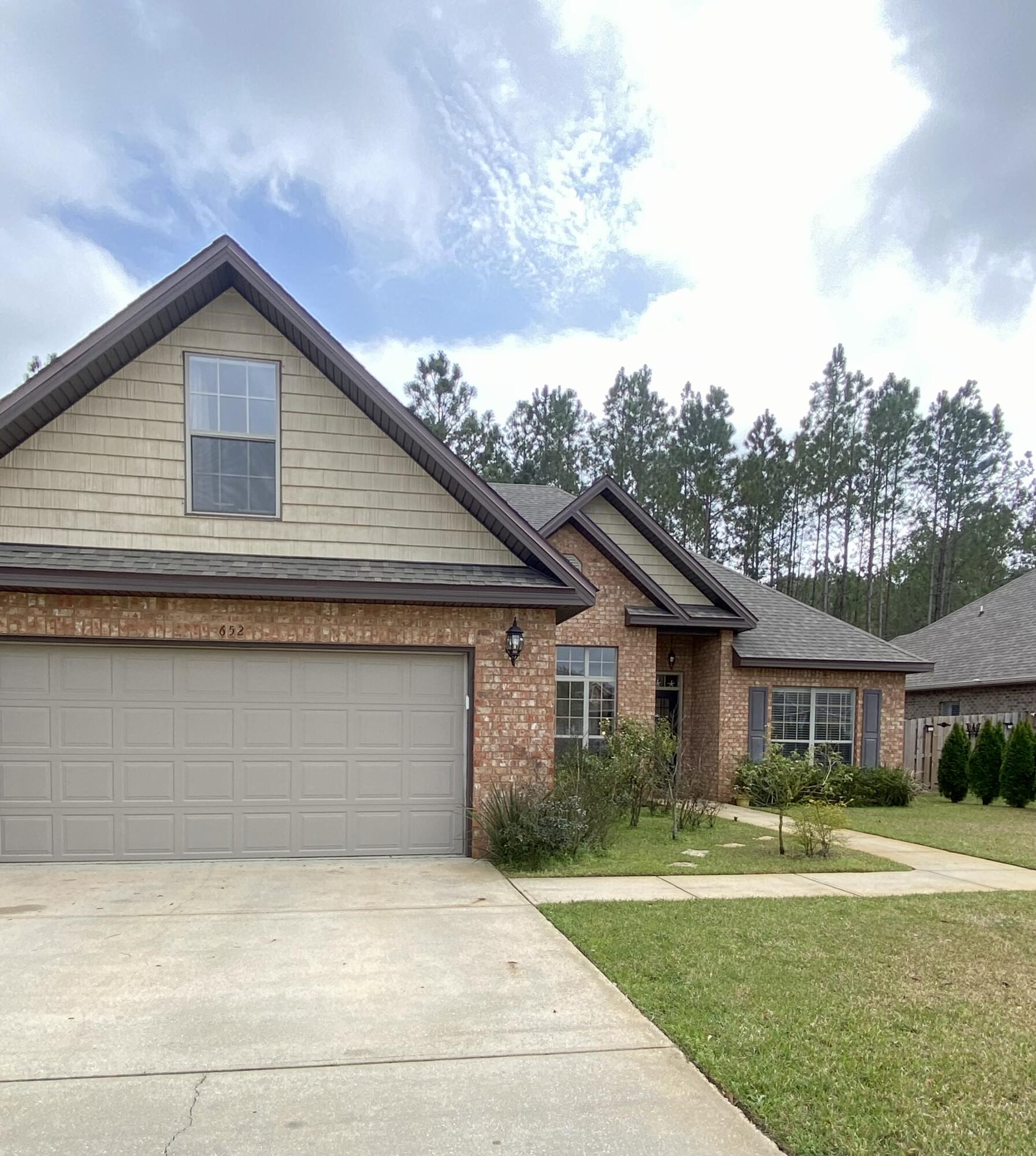 Discover the harmony of Hammock Bay's 'Symphony.' This gorgeous home has a split floor plan design with 4 bedroom/2.5 bath. Built with durability, convenience & comfort in mind. The vaulted ceiling compliment this spacious kitchen equipped with tons of cabinet space. This phenomenal kitchen is accented with granite counter tops, tile floor & breakfast bar. Enjoy your morning cup of joe under the covered patio or cookouts with guests. You'll also find a landscaped yard, equipped with a sprinkler system and well. Have some peace of mind during storms with hurricane shutters. Hammock Bay offers many amenities~ 24/7 fitness center, playground, pools, movie theater, general store etc. Short commute to/from military bases, beaches, schools and shopping. CDD PAID