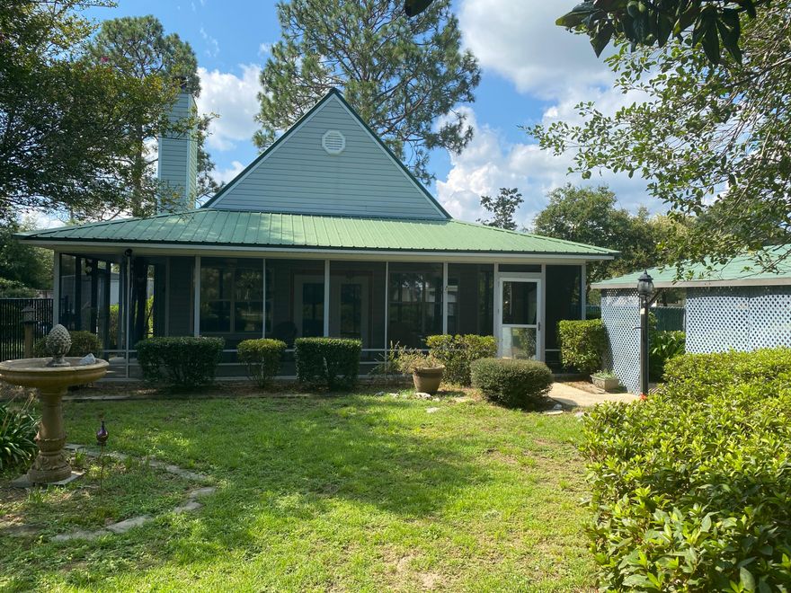 Cute & Cozy! Back on the market thru no fault of the seller. This 3 bed 1.5 bath makes a fantastic starter home, with mature, lovely landscaping on a 1/4 acre site. Downstairs is open concept with kitchen open to the living room w/ soaring vaulted ceiling and lovely fireplace. Kitchen is equipped w/ SS appliances and plenty of counter space with your solid surface countertops. Laminate & tile throughout - no carpet! Neutral colors. Downstairs are 2 beds & the full bath which also contains the laundry for space efficiency. Upstairs is the master bedroom and half bath. The screened front porch will keep you cool & mosquito free! Detached carport also. Qualifies for all types of financing. Homes in this price range don't come up often, so don't delay! Be sure to check out the 3D virtual tour.