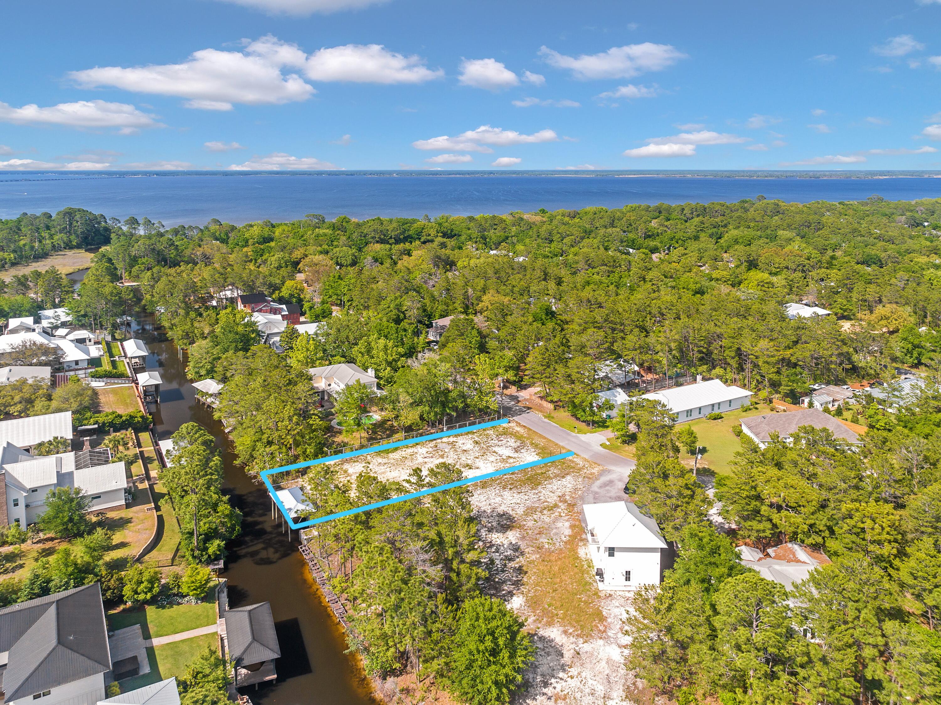 This beautiful quarter acre property (75ft wide by 150ft deep) in the heart of Point Washington is situated along Little Canal with deep water access to the Choctawhatchee Bay, enabling full enjoyment of all the nautical beauty and activities that this historic area has to offer. For those seeking year-round water access, this neighborhood--the Daughettes of Point Washington--is the most desired community in the entire 30A area, located within 5 minutes of historic Grayton Beach and within 7 minutes of renowned Seaside. This property is one of few buildable waterfront lots remaining in this highly-sought-after neighborhood, and with the owner having already built a dock, cleared the land, and tapped utilities; all that's left is to build your waterfront dreamhouse.
