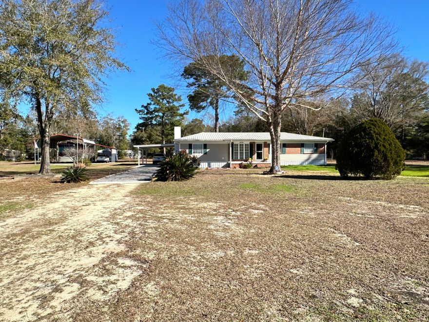 Perfect home on almost 3 acres less than 5 minutes to downtown Historic DeFuniak Springs! This home is 3 bedrooms with 2 1/2 bathrooms. The home was completely remodeled in 2010/2011 with all new wiring, plumbing, metal roof, water heater, etc. The home has 2 RV hookups with a polebarn and 2 storage sheds with a polebarn. The home has gas stove, gas water heater and the dryer can be gas or electric. You don't want to miss this beauty to call home! Call today to schedule your showing!