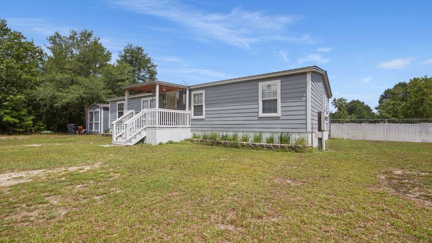 Welcome Home to this impeccably maintained property on over 1 acre located just 10 minutes from downtown DeFuniak Springs. The home has hardy plank siding and a large, covered porch for entertaining.The primary bedroom and bathroom have been redesigned to create a relaxing retreat while the rest of the home is spacious and thoughtfully laid out. The floor plan is split with the other two bedrooms being off of the living room,. while the primary bedroom if off of the foyer. The backyard is fully fenced for your pets' safety. There is a storage building complete with electricity for additional storage needs.