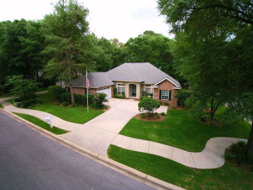 *Home warranty included**This is NOT your typical Crestview home-amazing location in the upscale gated community, Claire's Vineyard! Quick access to shopping, schools, and military bases. This beautifully cared for, Key Lime Builder, home features 4 spacious bedrooms and 3 full bathrooms. Don't miss the raised ceilings, recessed/pendent lighting package, crown molding, hardwood flooring, and custom cabinetry. The well thought out floor plan also provides a formal dining room and private office/den area. Kitchen is open to the living space and has a large breakfast nook with bay window, accommodating of a good sized table. Master suite area features access to the welcoming, screened in patio area.