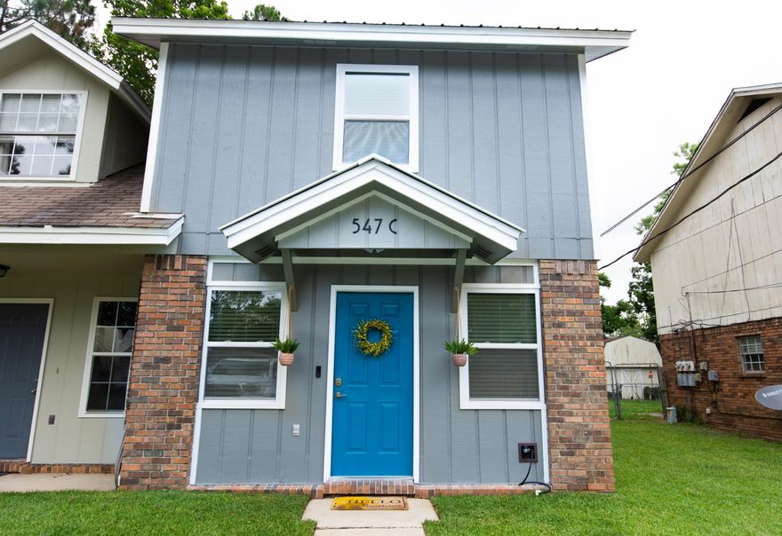 Meticulously maintained with modern details, this home 2 bedroom, 1.5 bathroom townhouse is sure to wow you! This home has been newly updated with everything from floors to stainless steel appliances to an electric fireplace. Complete with a large deck and backyard area for pets and entertaining, this is an impressive house, both inside and out.