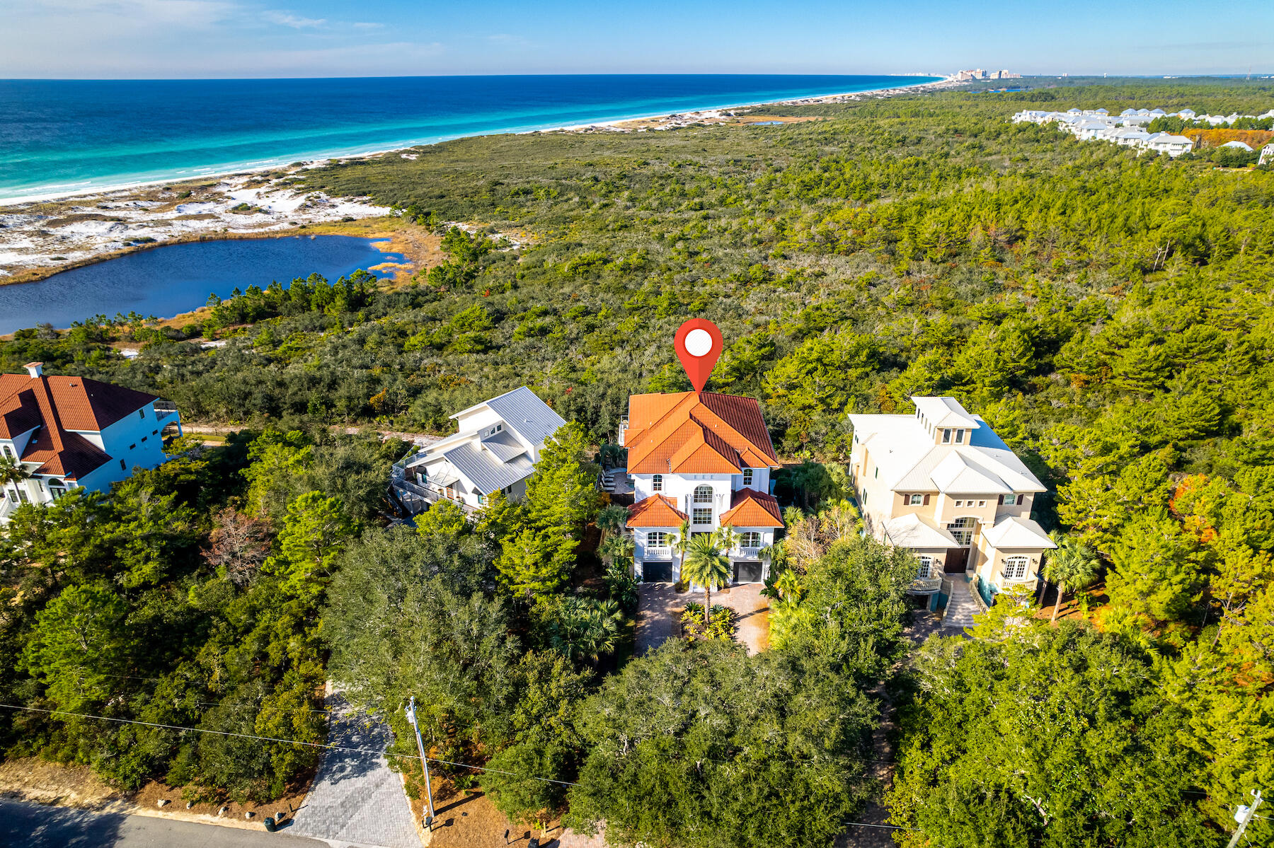 This 5BR/5BA home is artfully situated on the border of Topsail Hill Preserve State Park offering unmatched panoramic views extending through the State Preserve Park, over a rare Coastal Dune Lake, and straight into the Gulf of Mexico. This custom home is the perfect combination, providing complete luxury in concert with a flexible family lifestyle. Recently renovated, this Mediterranean home offers three levels, which are all accessible by elevator. The welcoming and open concept main floor living area presents endless views and plenty of room for entertaining, while the fully equipped and remodeled gourmet kitchen offers commercial grade appliances including gas range, drawer microwave, leathered quartzite countertops, Thermador refrigerator and oversized kitchen island with