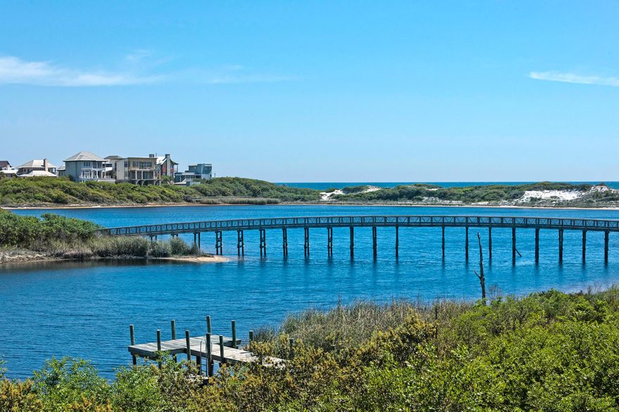 Waterviews galore, this Watersound Lake front home enjoys 2,000 square feet of spacious porches and balconies accessed by the accordian doors that invite the outdoors in! Level 1 host 3 Guest Bedrooms with ensuite Baths and flows out to a vast screened porch with outdoor fireplace and TV. The Level 2 has an open Living/Dining/Kitchen that luxuriates in sharing an immense outdoor balcony through doors that float out of view. A convenient grilling porch offers a separate dining area adjacent to the living area. Another Guest (Bunkroom) and Bath occupies this level. Level 3 delights in a stunning Master Suite with private balcony, Gulfviews and it's own bar. The garage adds a plethora of storage and the beach toys are included in the sale. Plenty of room to add a POOL!